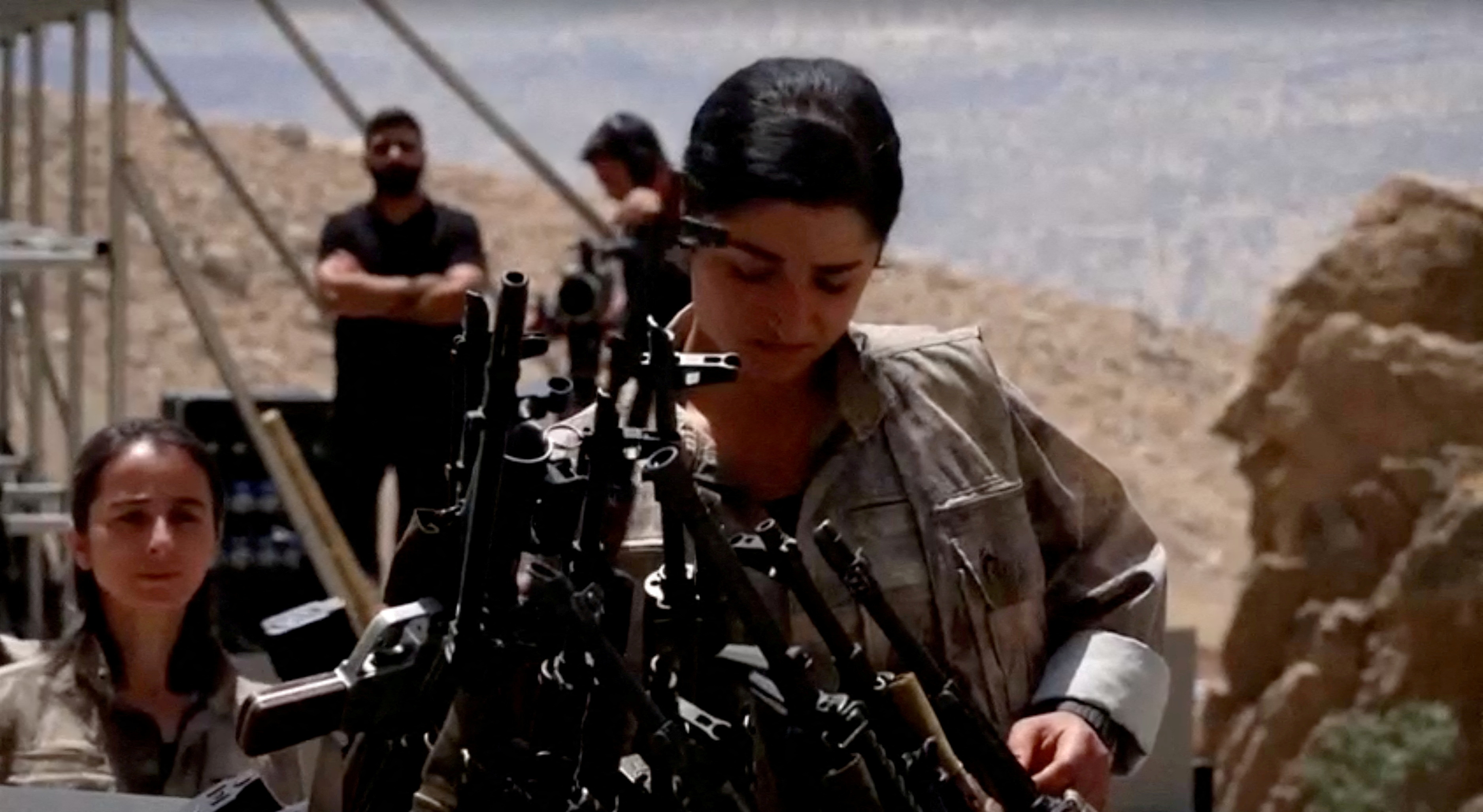 FILE PHOTO: PKK fighters burn weapons during disarming ceremony in Iraqi Kurdistan