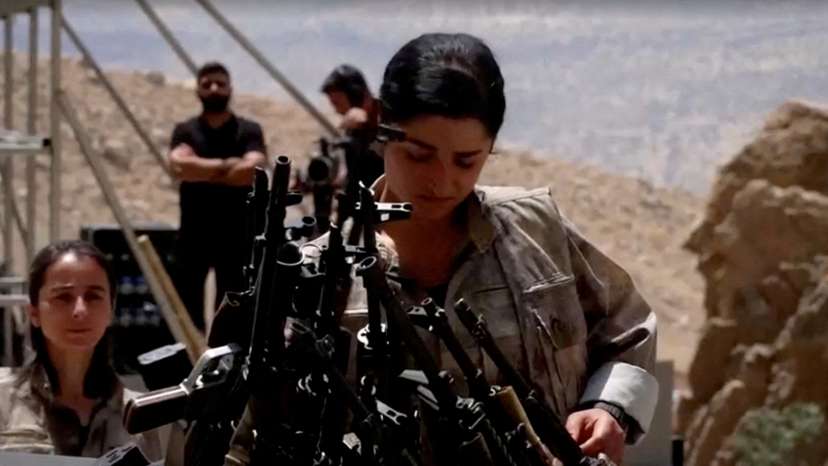 FILE PHOTO: PKK fighters burn weapons during disarming ceremony in Iraqi Kurdistan