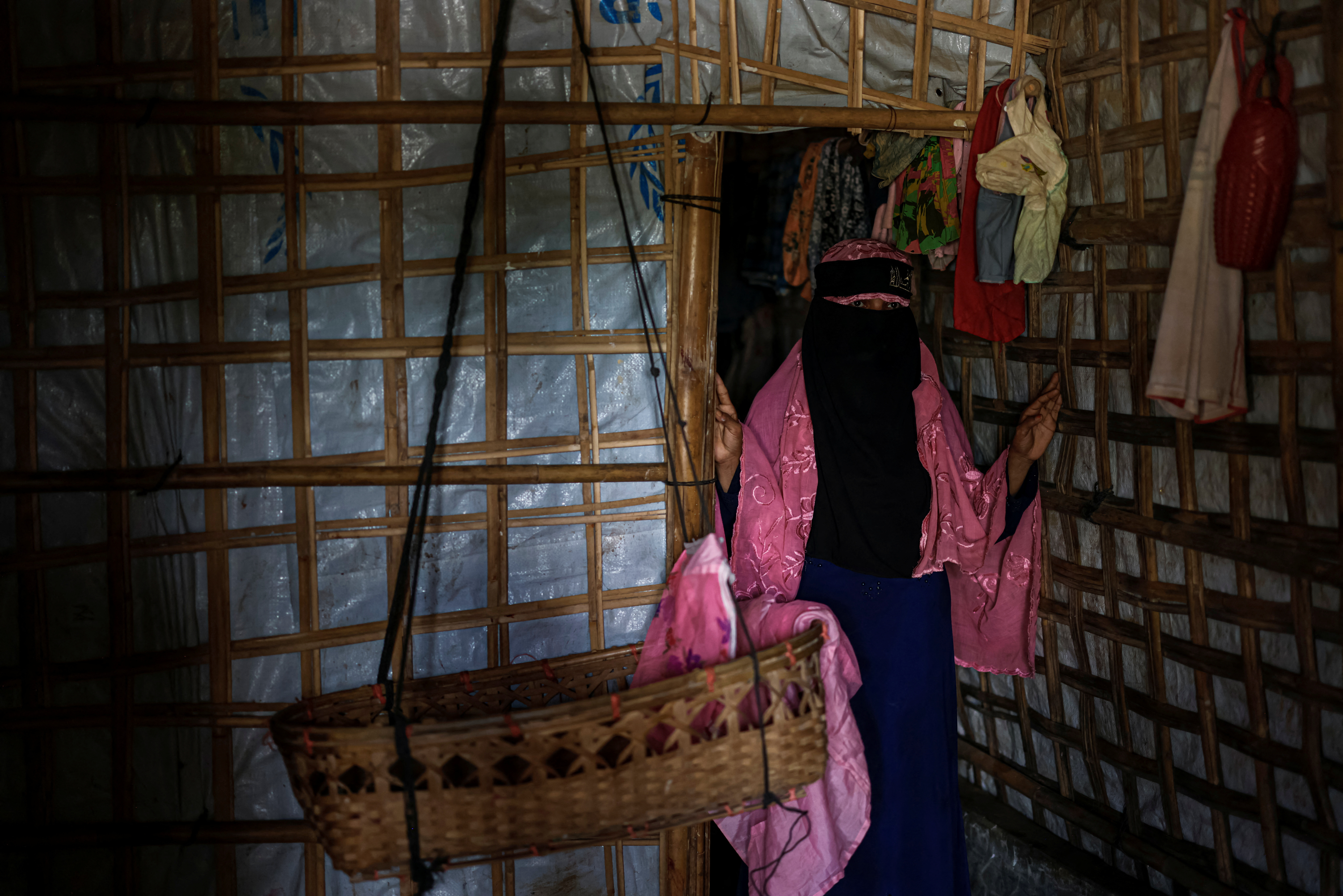 Begum, 35-year-old mother of seven children, who is marrying off one of her daughters following the funding shortage, poses for a picture, in Cox's Bazar