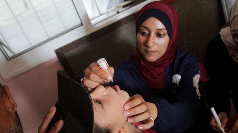 Palestinian children are vaccinated against polio, in Jabalia