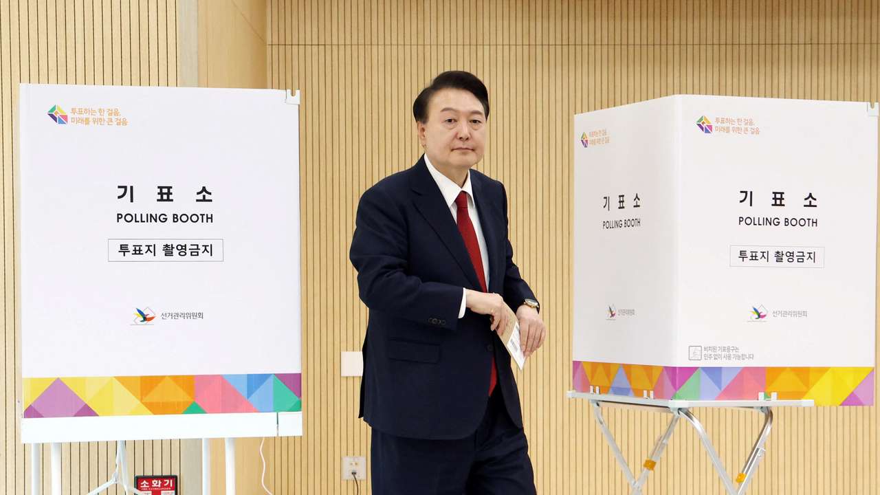 South Korean President Yoon Suk Yeol casts his early vote for 22nd parliamentary election, in Busan