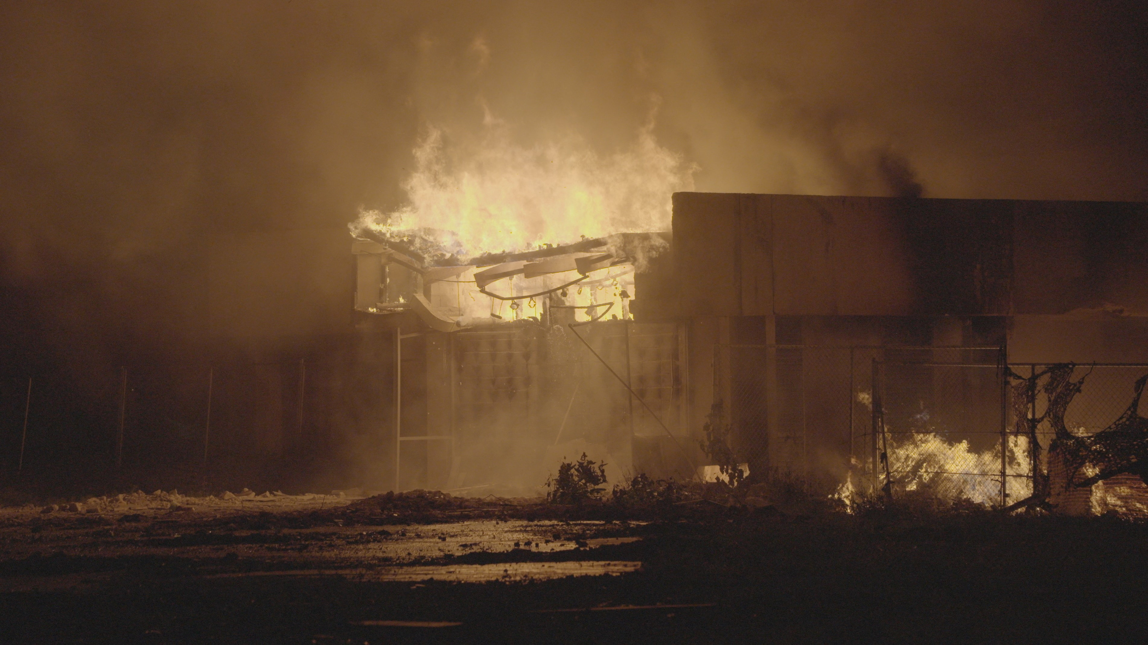 A fire burns at the national parliament of the Marshall Islands, in Majuro