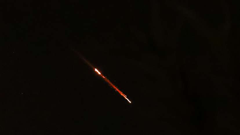 Objects are seen in the sky above Jerusalem after Iran launched drones and missiles towards Israel, in Jerusalem