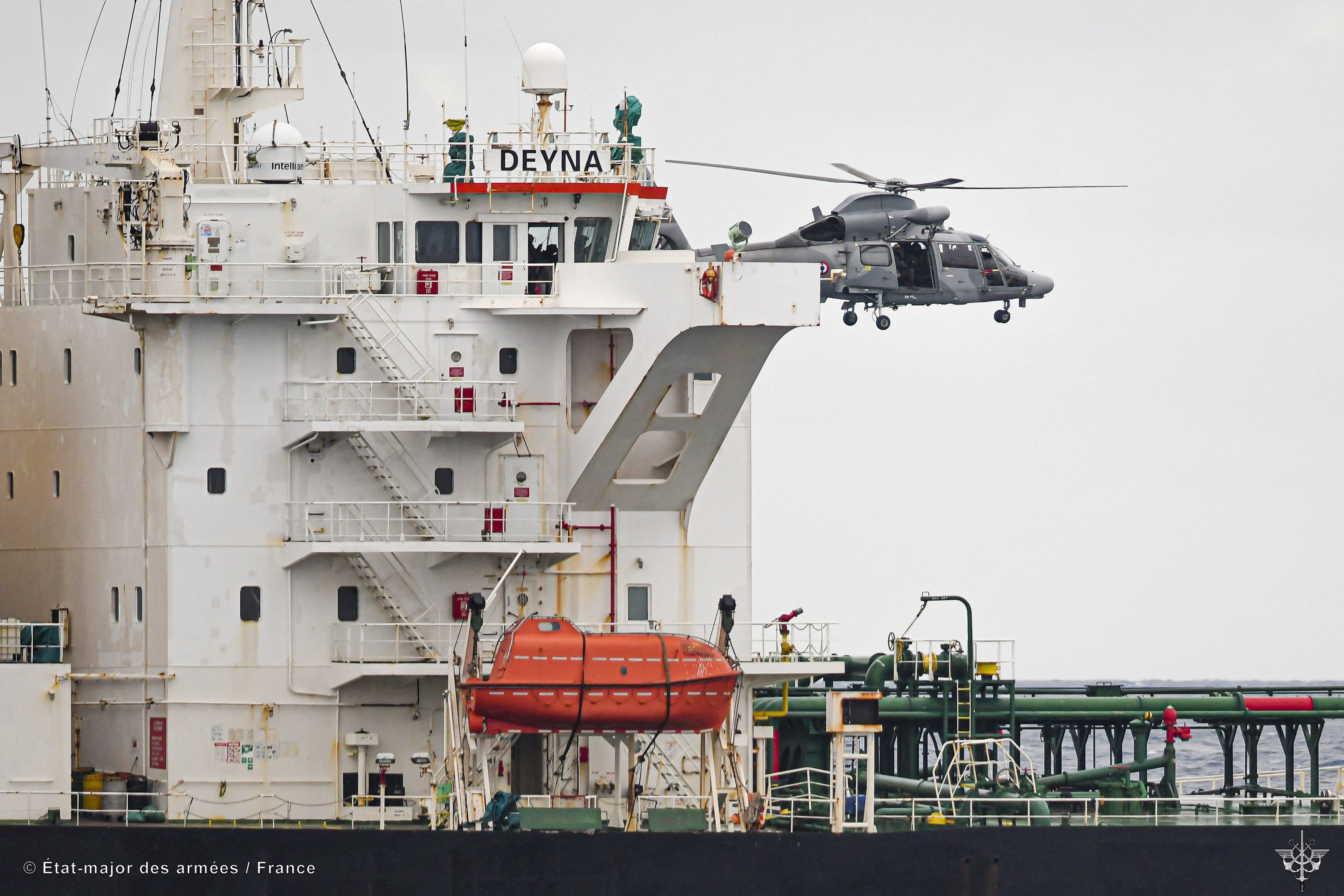 A French Navy helicopter hovers over the Deyna vessel, which is supposed to be a member of the Russian shadow fleet, during an operation in the Western Mediterranean Sea