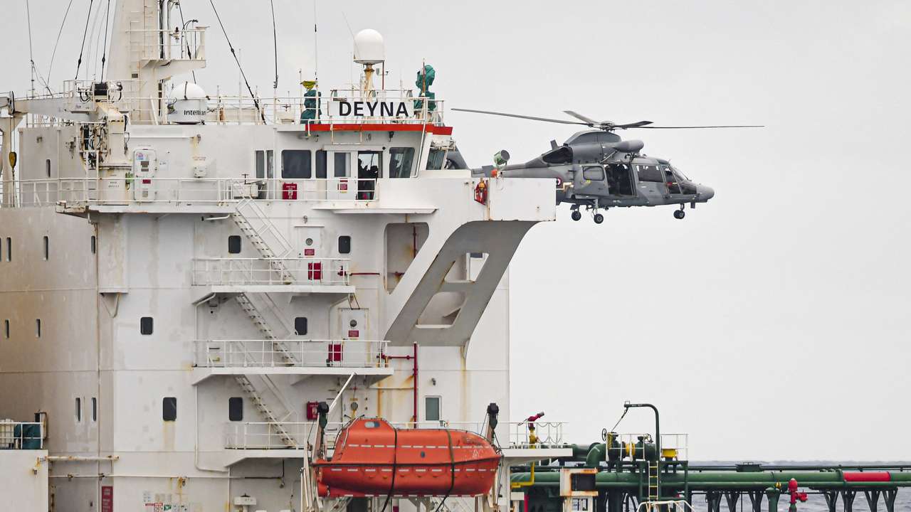 A French Navy helicopter hovers over the Deyna vessel, which is supposed to be a member of the Russian shadow fleet, during an operation in the Western Mediterranean Sea