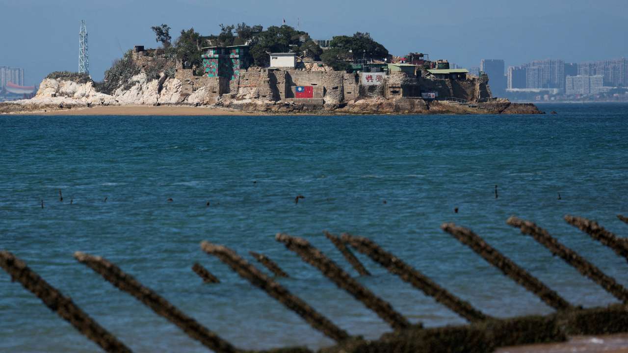 FILE PHOTO: Shiyu or Lion Islet, which is part of Kinmen County, one of Taiwan's offshore islands, is pictured with China's Xiamen in the background, in Kinmen