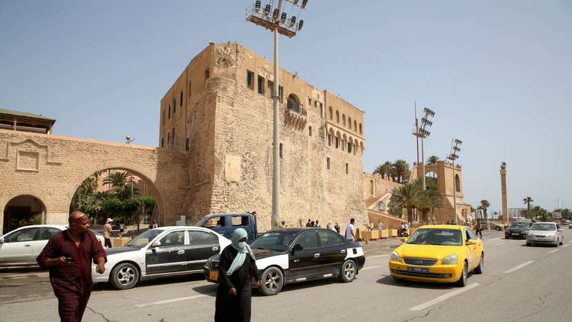 FILE PHOTO: People cross a street at Martyrs Square in Tripoli