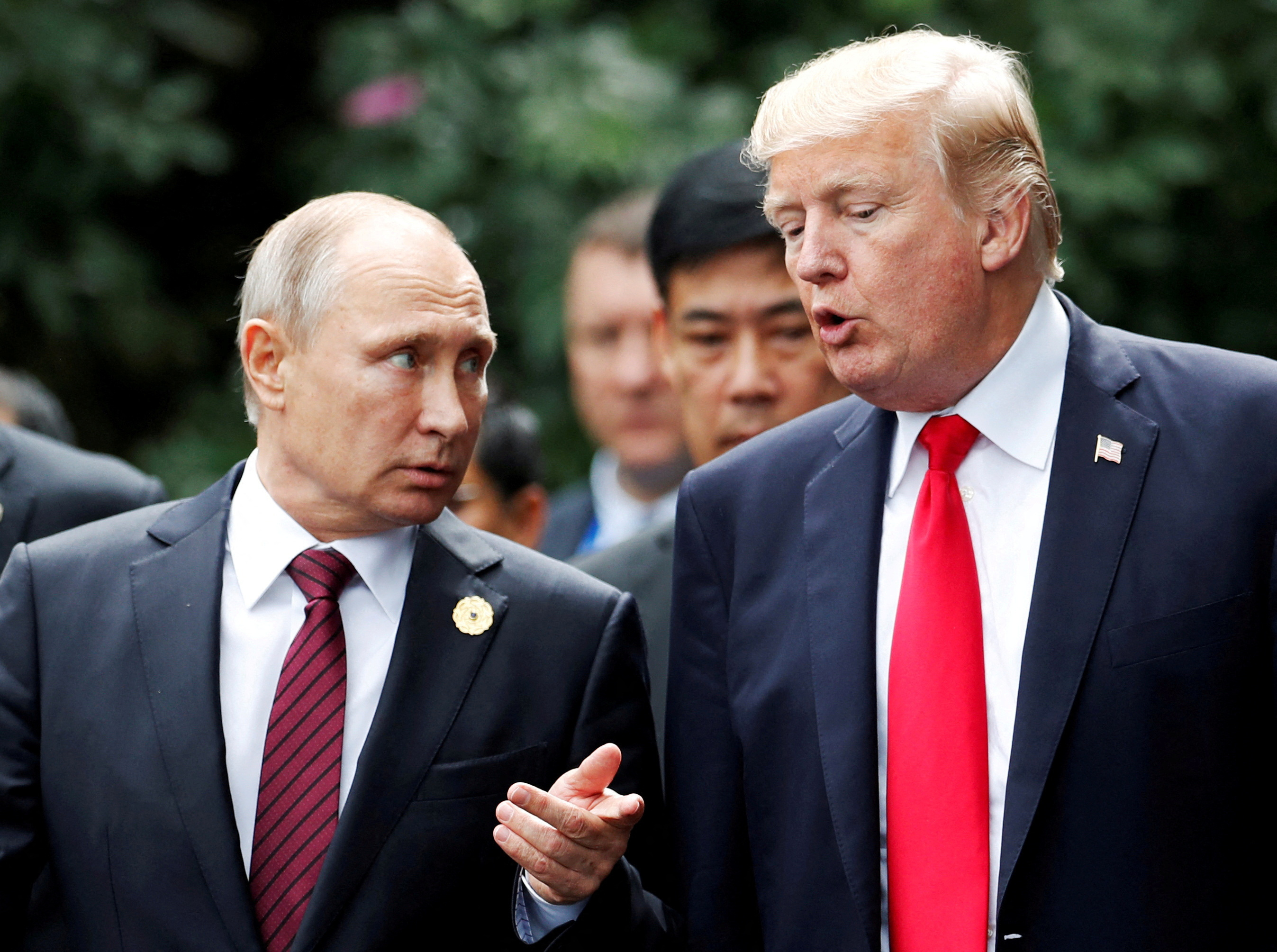 FILE PHOTO: FILE PHOTO: U.S. President Donald Trump and Russia's President Vladimir Putin talk during the family photo session at the APEC Summit in Danang, Vietnam