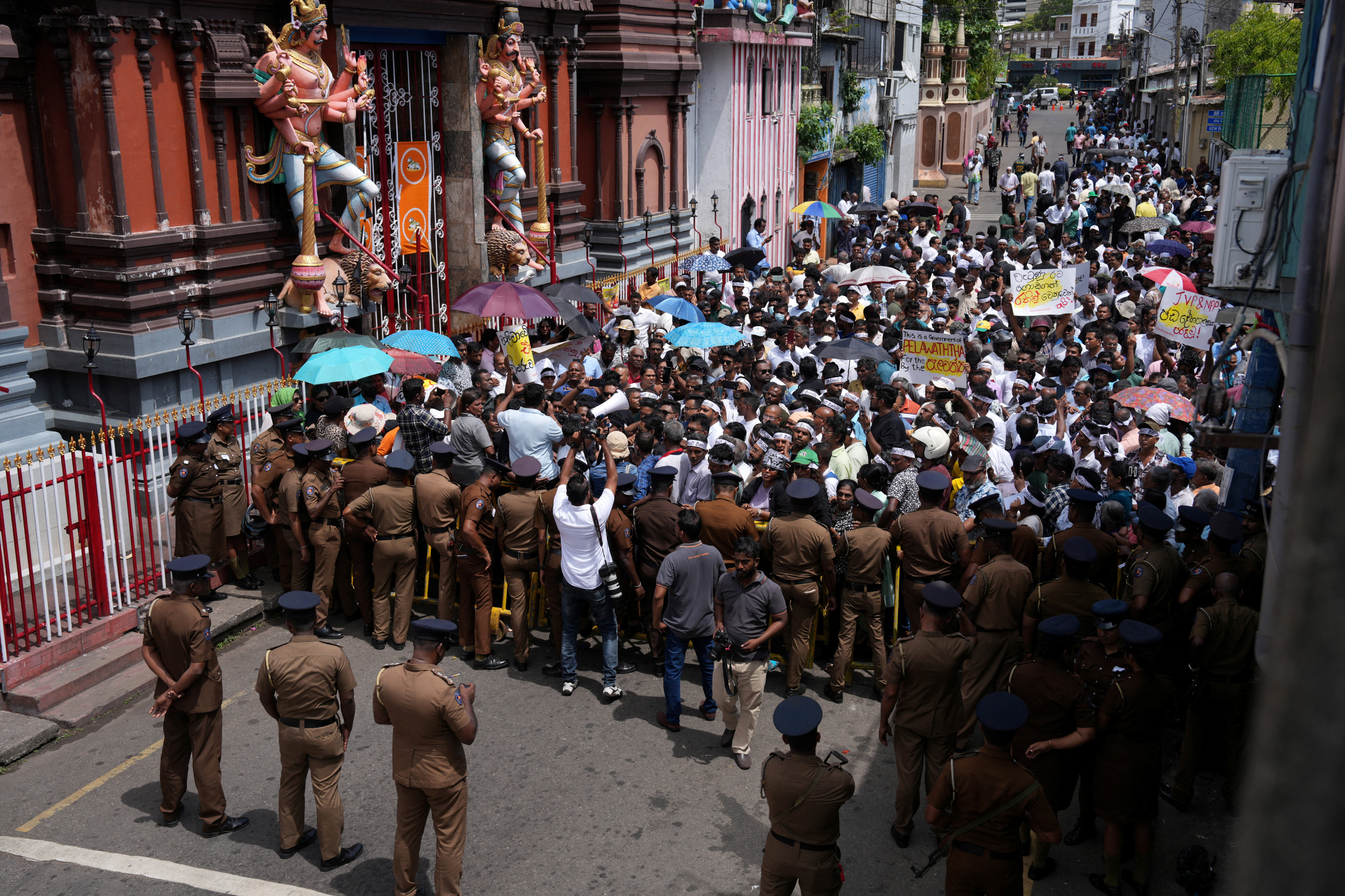 Supporters of Sri Lanka's former President Wickremesinghe gather ahead of his bail hearing, in Colombo