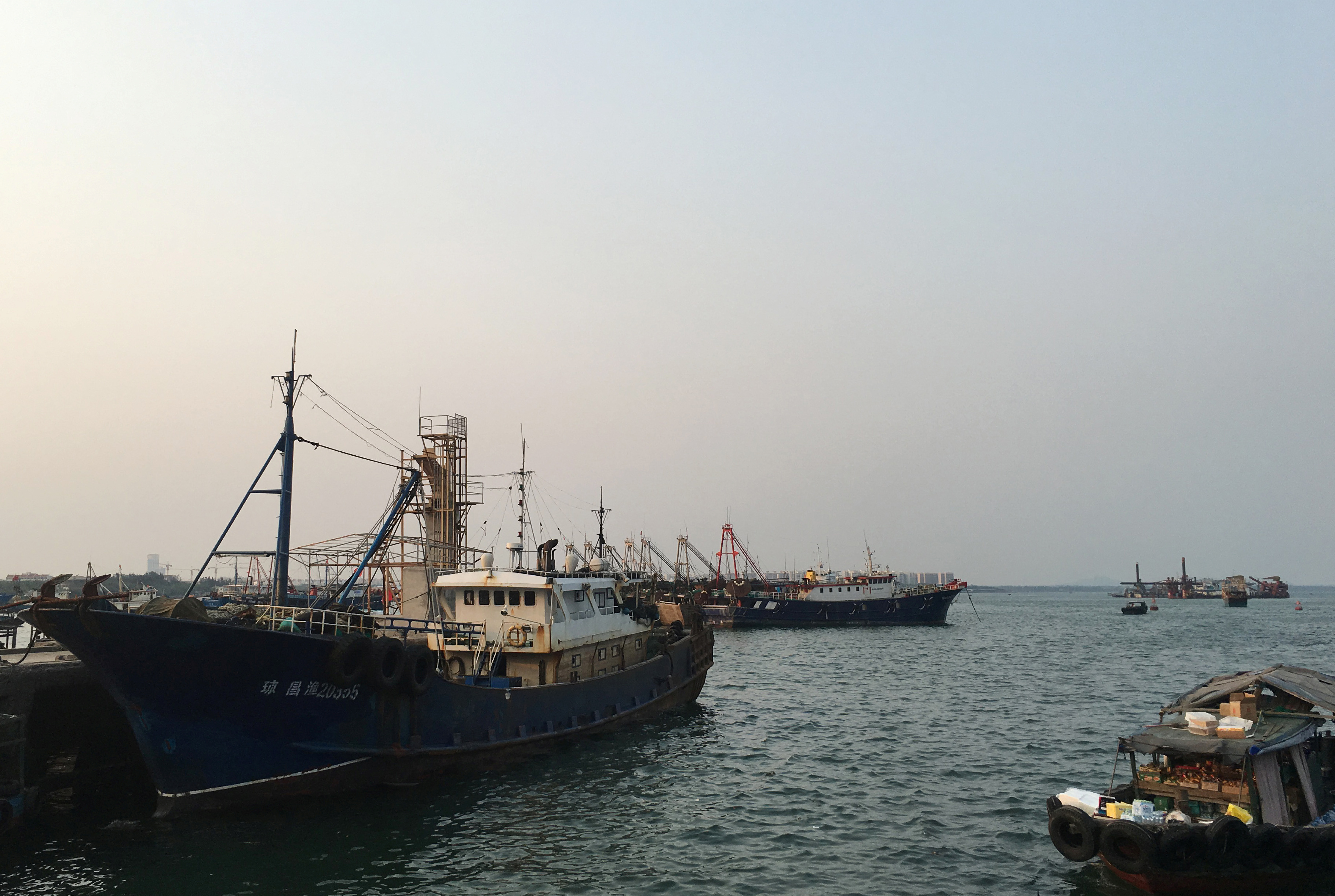 Fishing boats are seen at a harbour in Baimajing, Hainan province