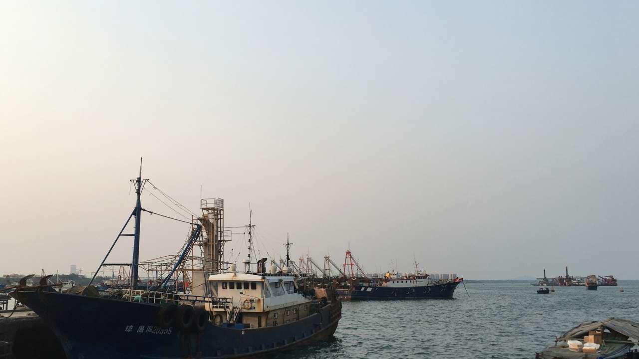Fishing boats are seen at a harbour in Baimajing, Hainan province