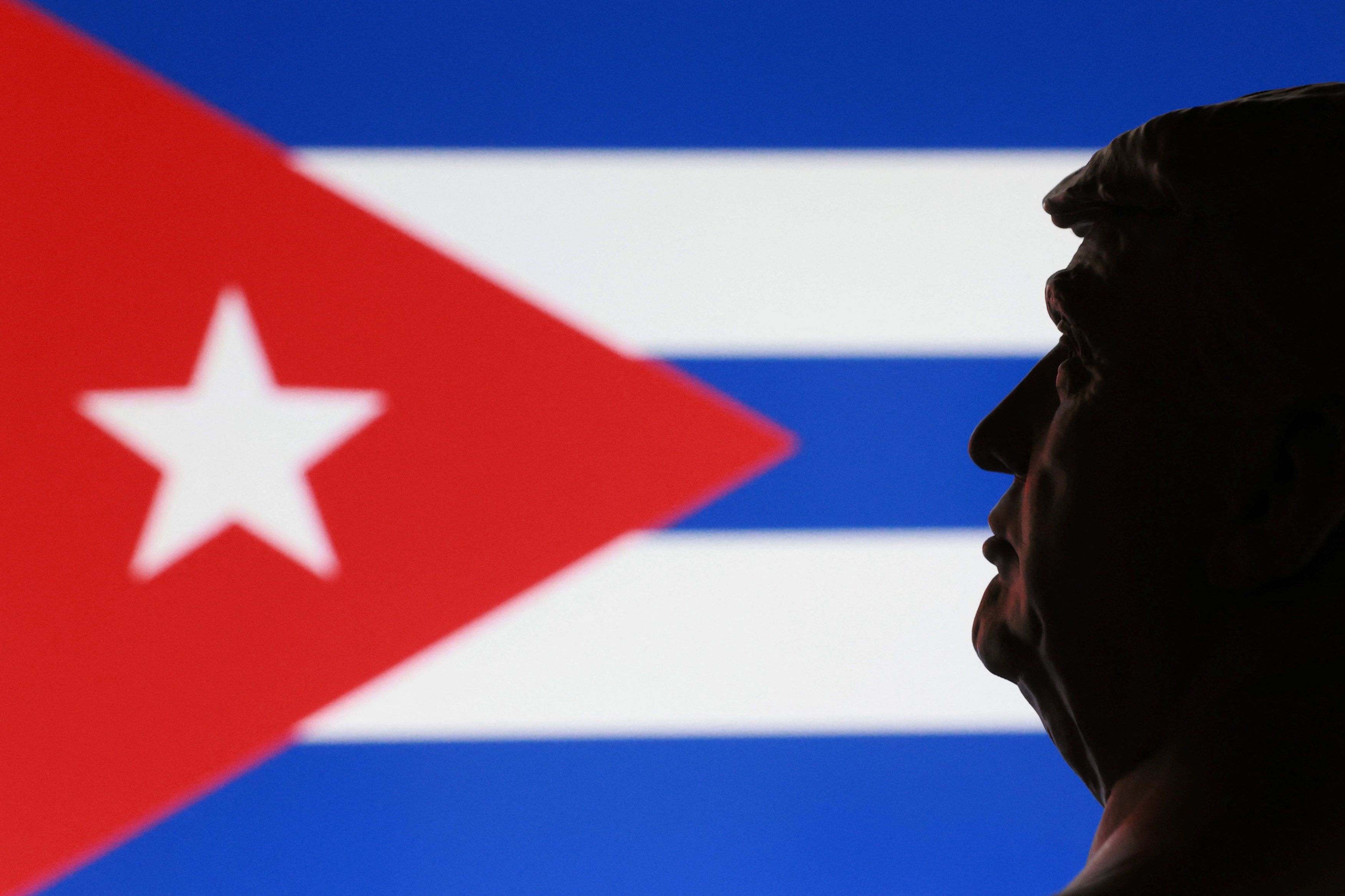 Illustration shows 3D printed miniature of U.S. president Donald Trump and Cuban flag
