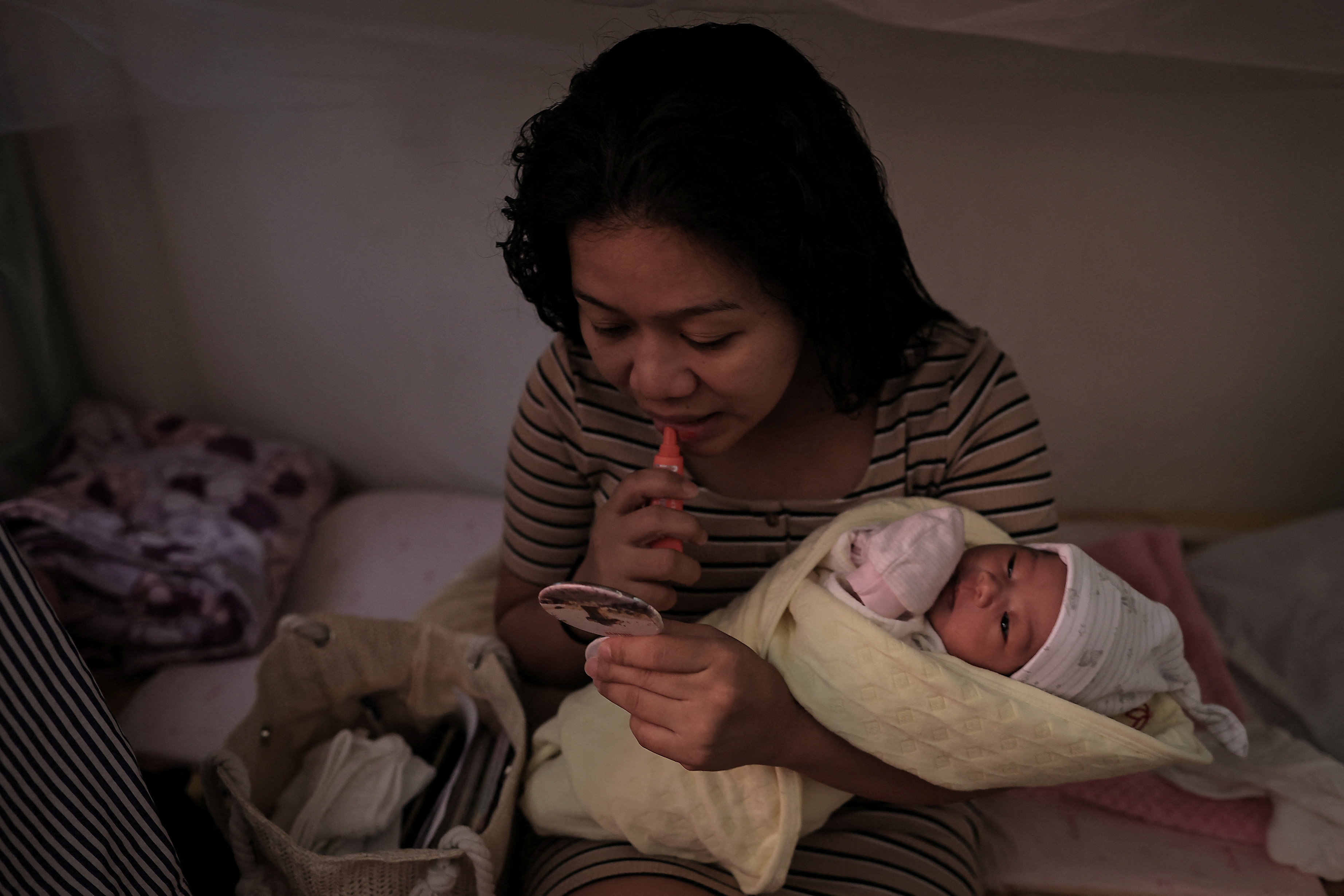 The Wider Image - Left behind: A Filipina migrant mother’s struggle in Taiwan