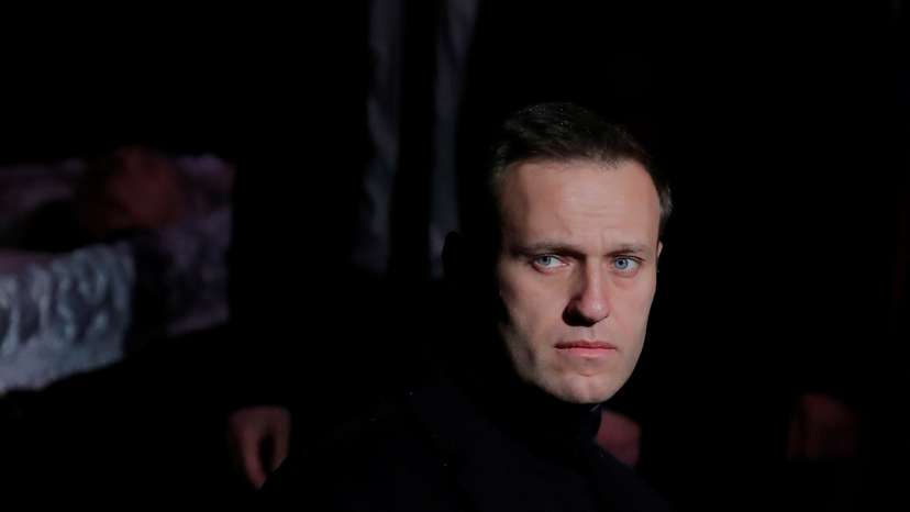 FILE PHOTO: Russian opposition leader Navalny pays respect to human rights activist Alexeyeva in Moscow