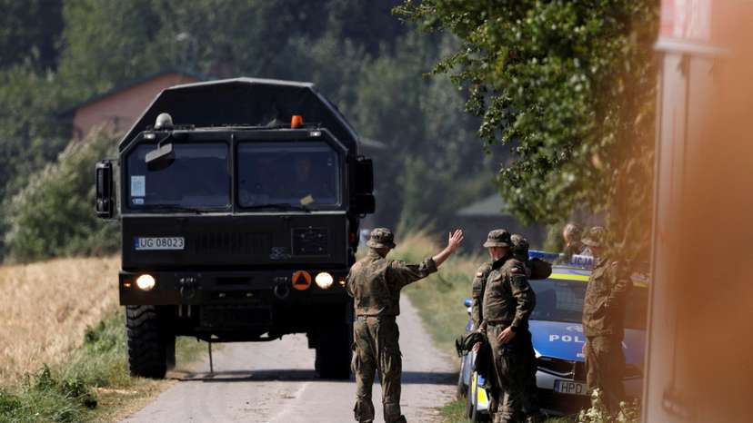 Soldiers stand guard near the site a Russian drone is believed to have fallen after intrusions into Polish airspace, in Czesniki
