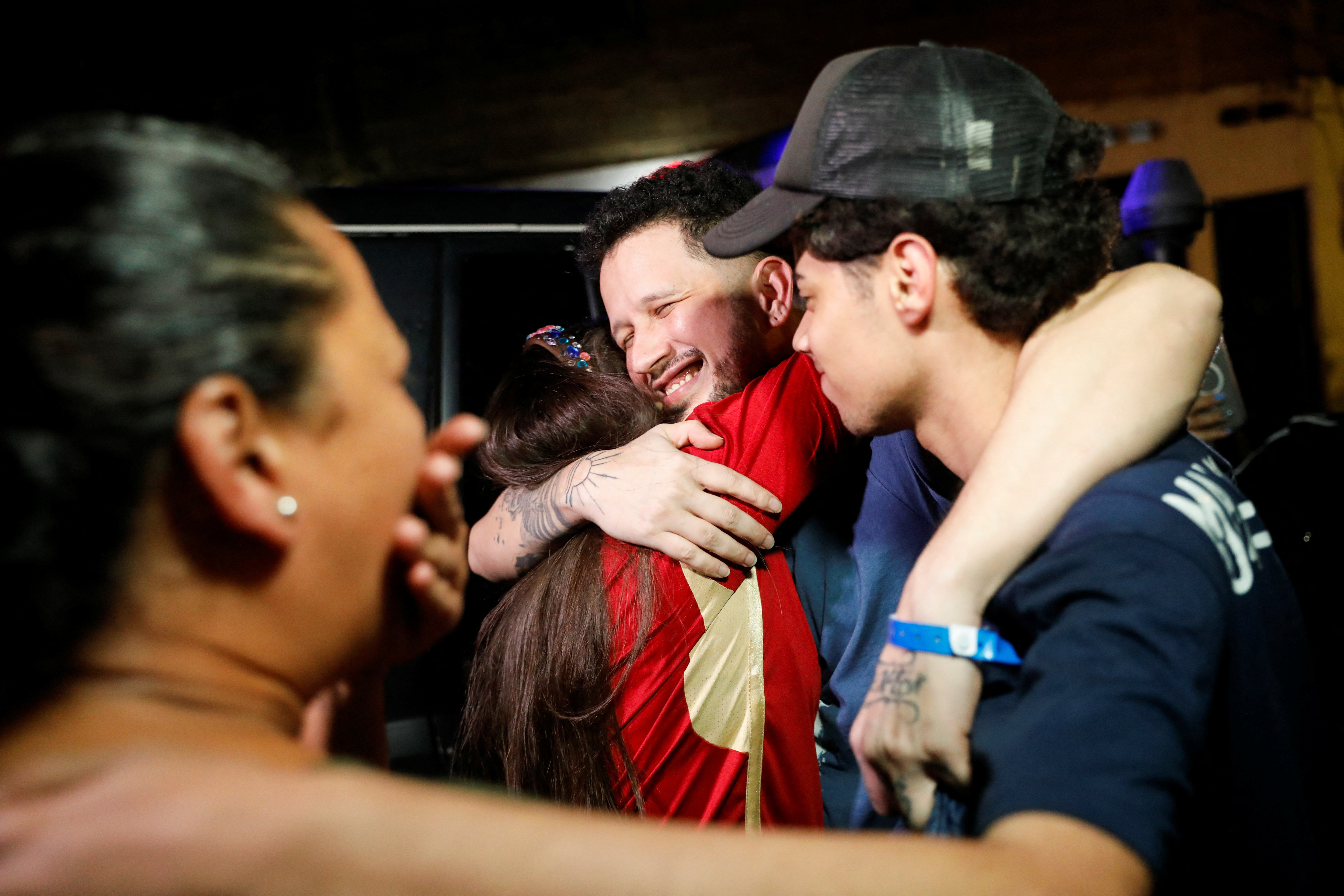 Arturo Suarez, who was held for months in an El Salvador prison, greets family members after his release, in Caracas
