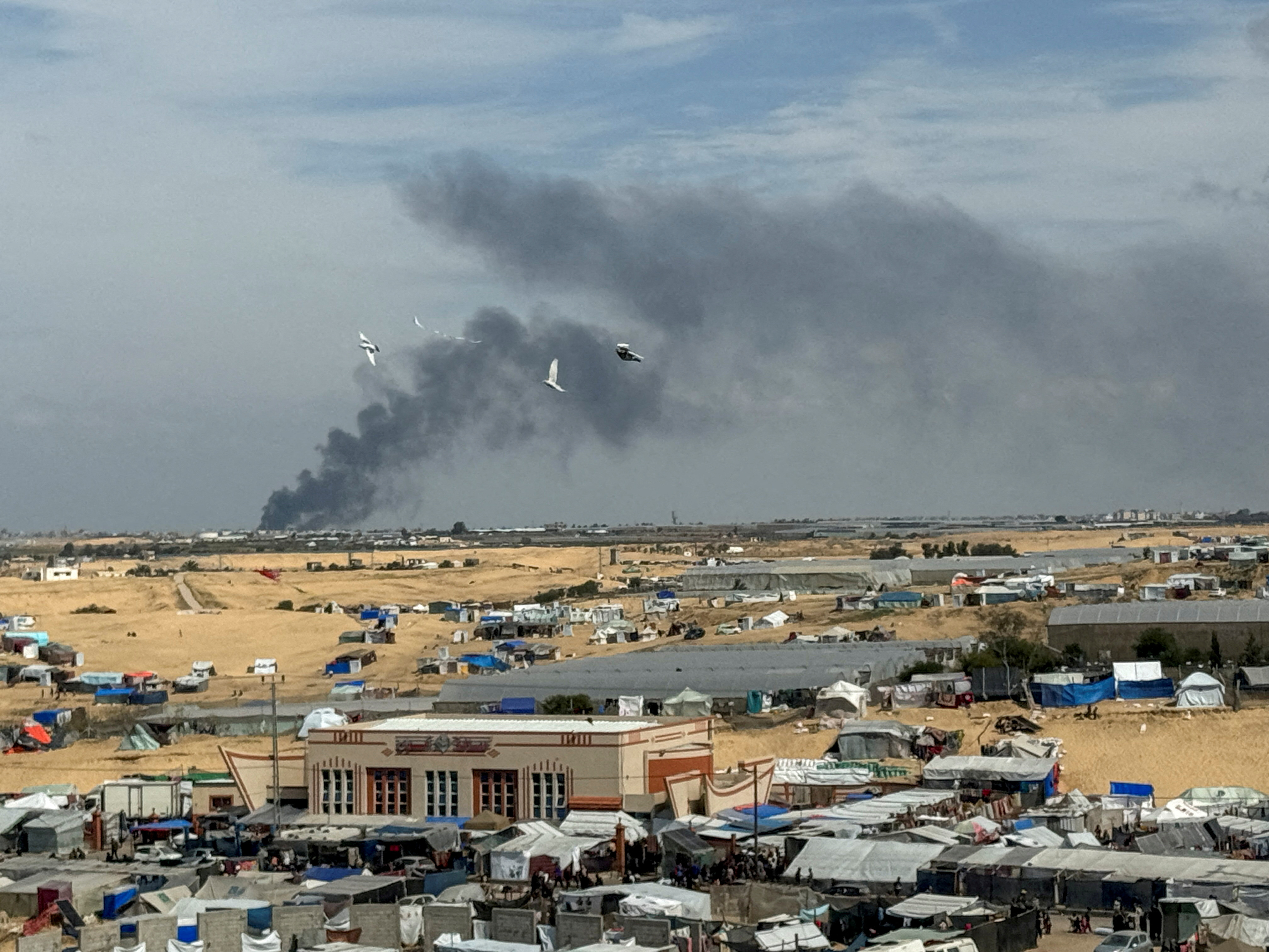 FILE PHOTO: Smoke rises during an Israeli ground operation in Khan Younis, as seen from Rafah
