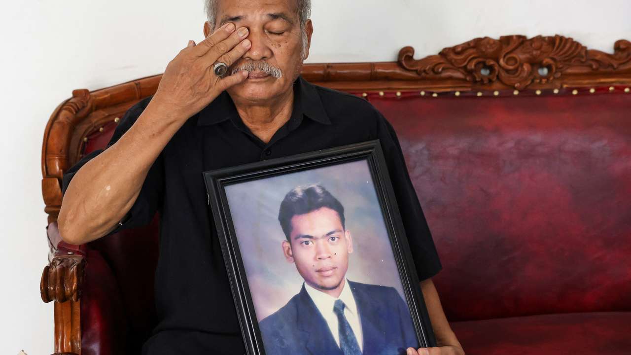 Paian Siahaan, the 77-year-old father of Ucok Munandar Siahaan reacts during an interview at his house in Depok on the outskirts of Jakarta