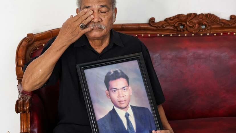 Paian Siahaan, the 77-year-old father of Ucok Munandar Siahaan reacts during an interview at his house in Depok on the outskirts of Jakarta