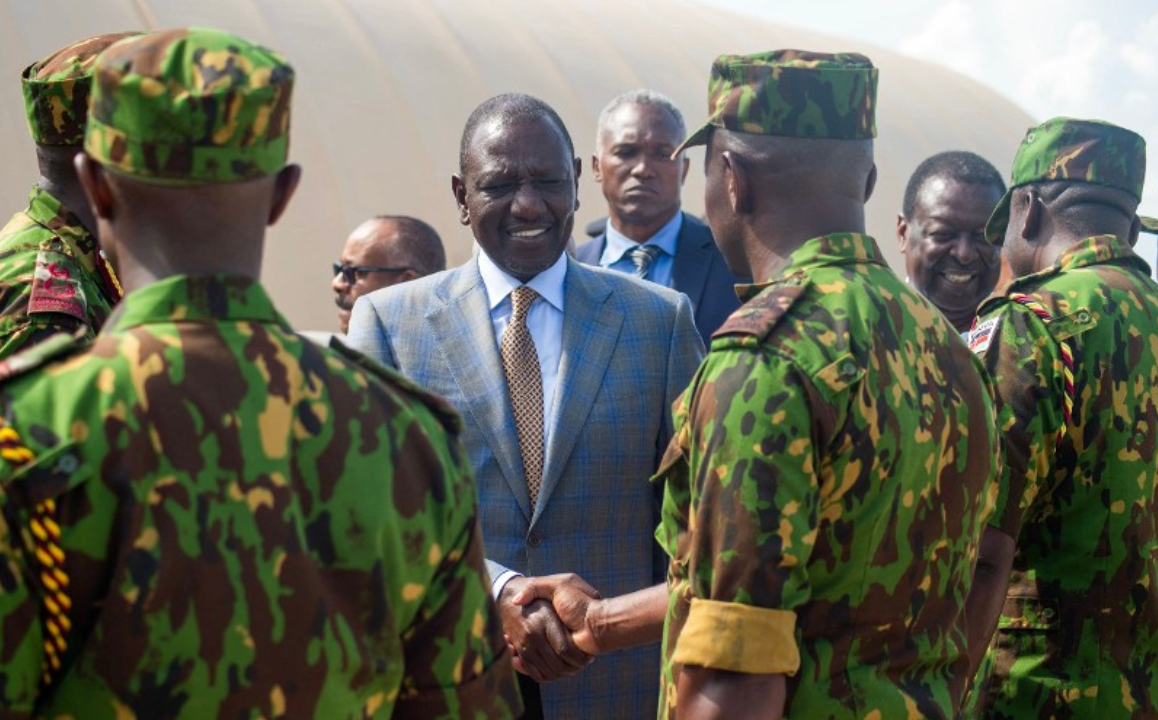 Kenyan President William Ruto is greeted by Kenyan police officers as he arrives at the Toussaint Louverture International Airport in Port-au-Prince, Haiti