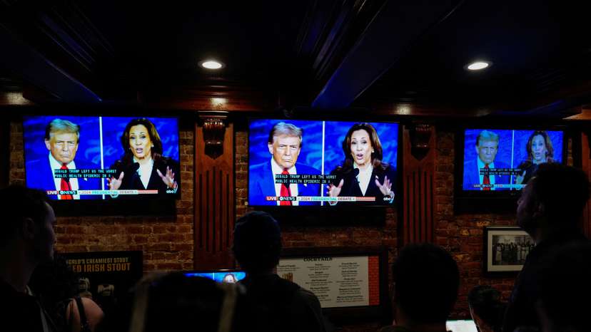 People watch the presidential debate between Trump and Harris, in New York