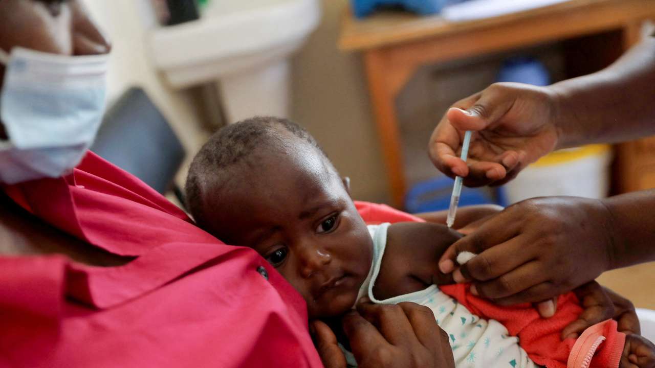 FILE PHOTO: A nurse administers the malaria vaccine to an infant at the Lumumba hospital in Kisumu