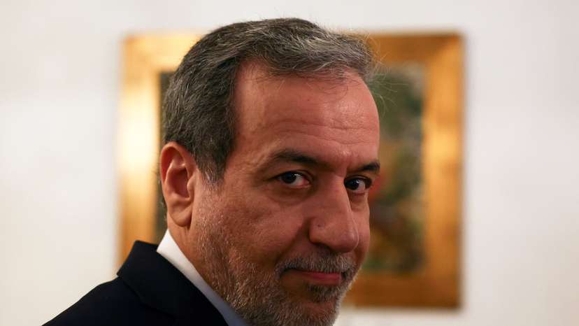 Iranian Foreign Minister Abbas Araghchi gives a briefing on the sidelines of a UN event in Lisbon