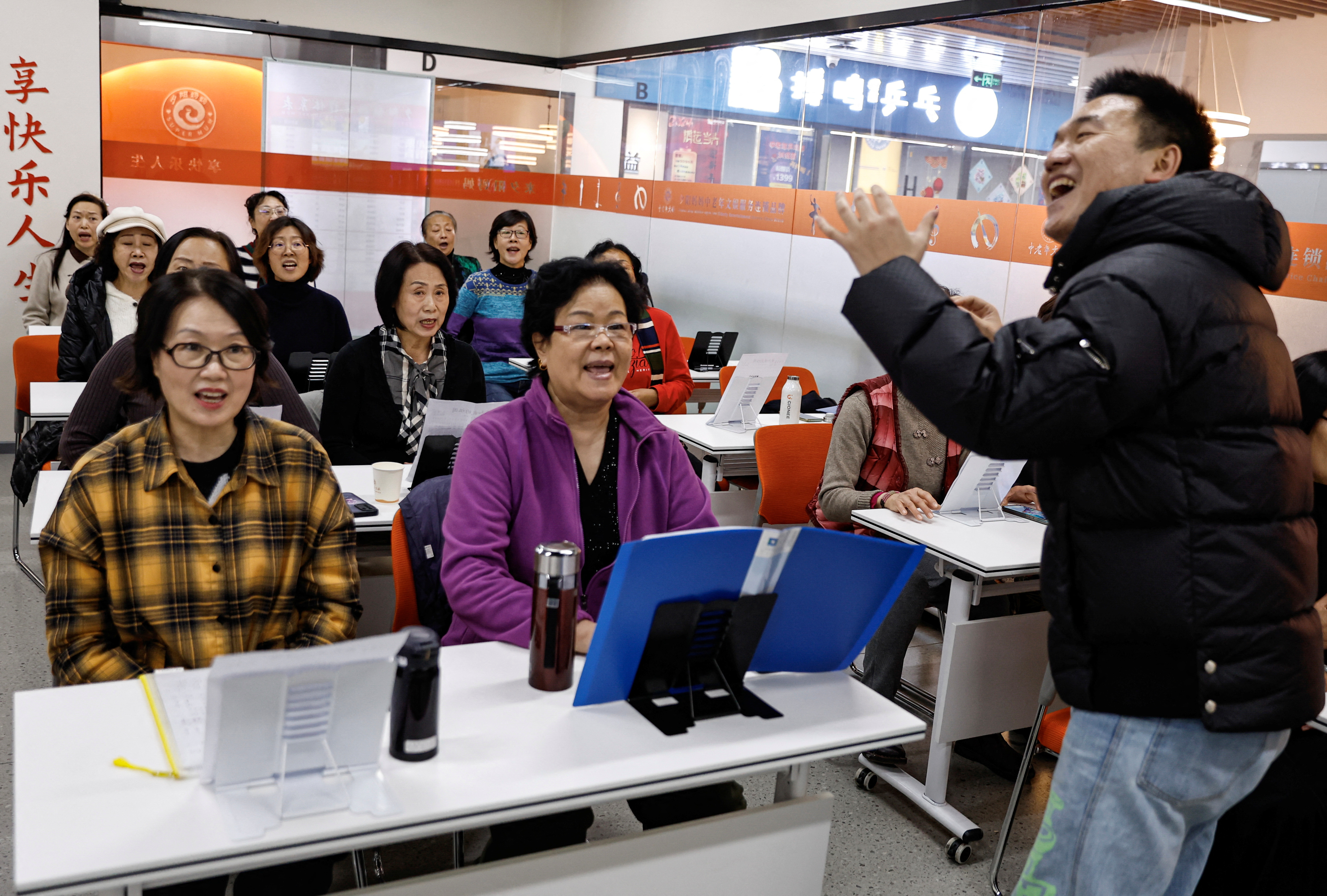 Woman attend a singing class at Mama Sunset, in Beijing
