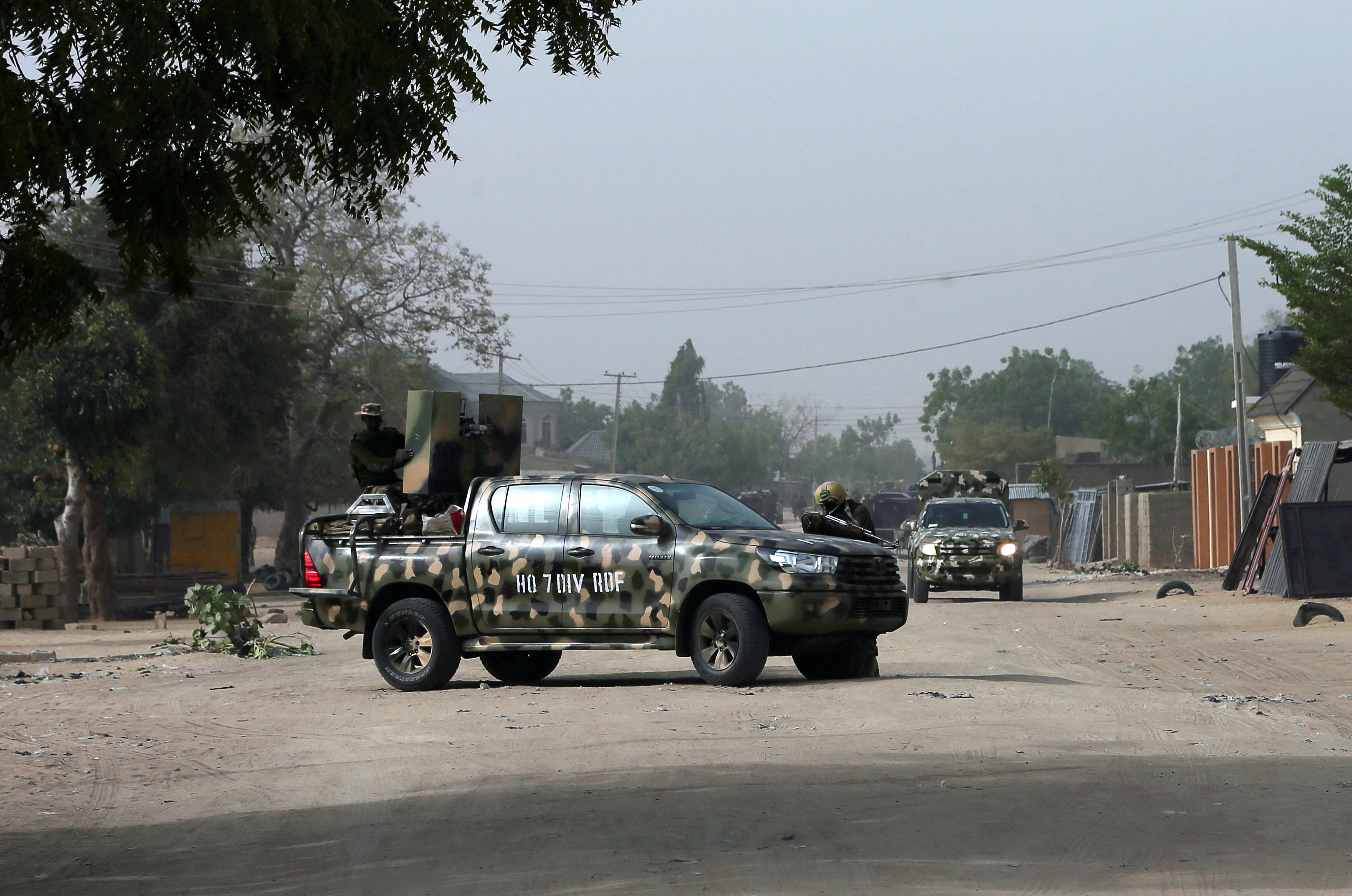 FILE PHOTO: Nigerian military secure the area where a man was killed by suspected militants during an attack around Polo area of Maiduguri