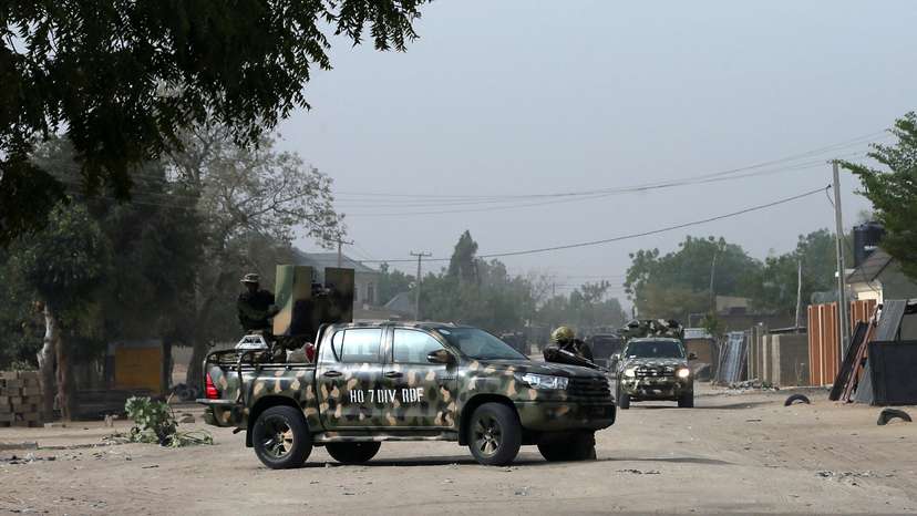 FILE PHOTO: Nigerian military secure the area where a man was killed by suspected militants during an attack around Polo area of Maiduguri