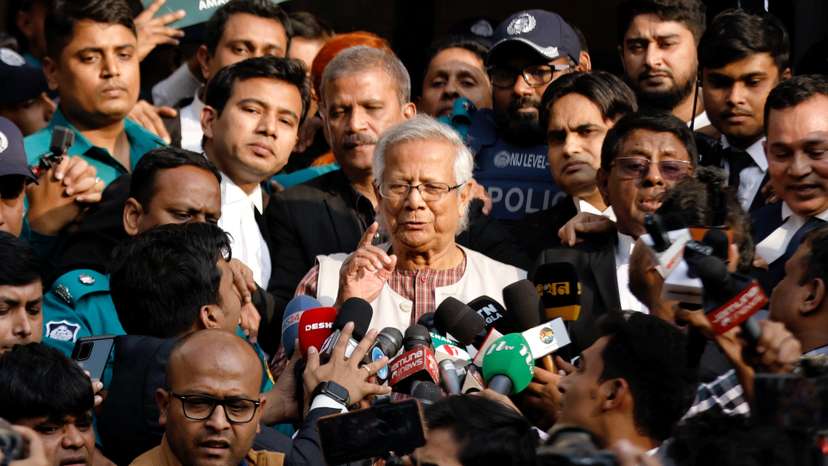 FILE PHOTO: Bangladeshi Nobel peace laureate Professor Muhammad Yunus gestures in front of the court after being sentenced for six months of imprisonment, in Dhaka