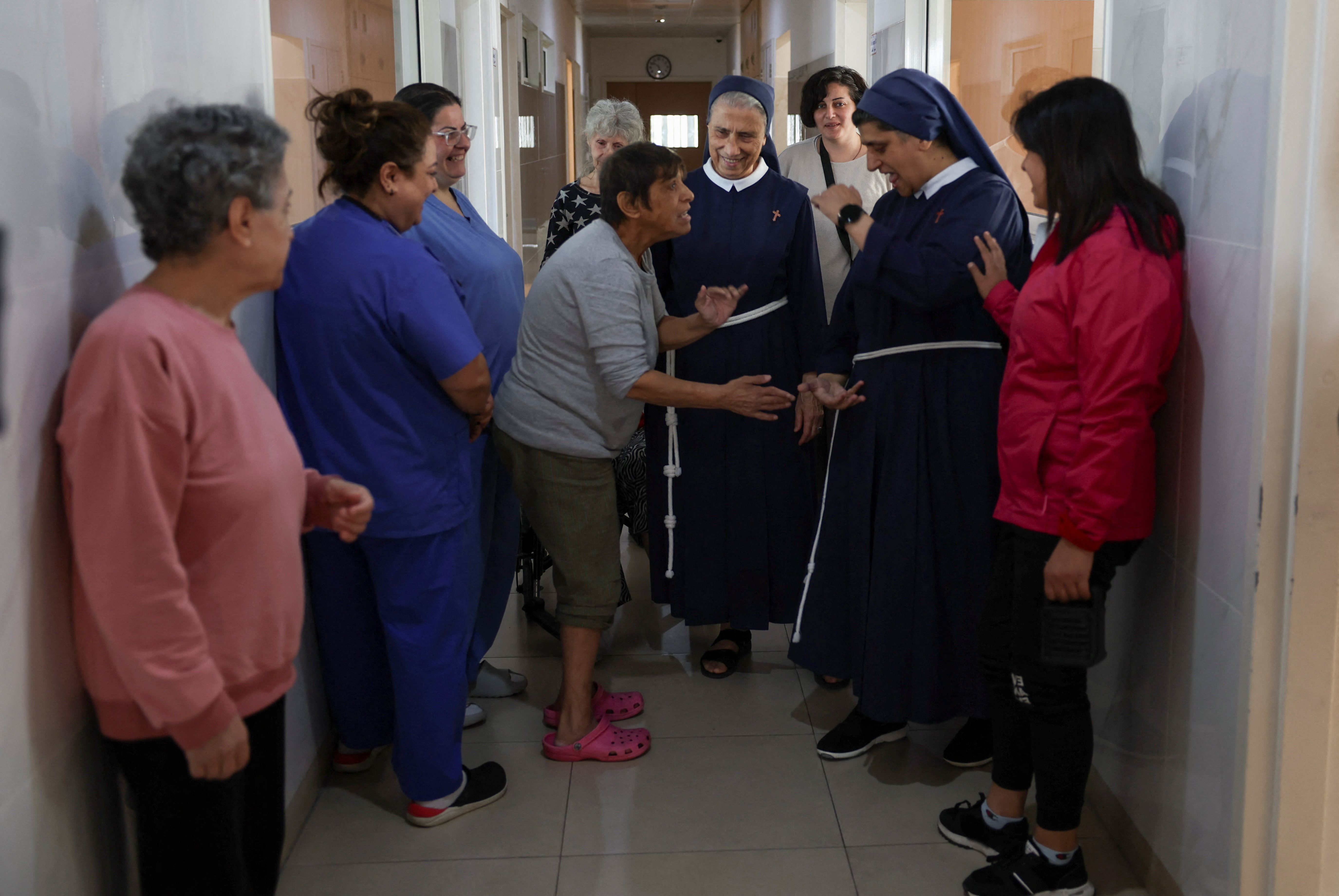 General superior of the congregation of the franciscan sisters of the cross, Mother Marie Makhlouf and Director of De La Croix Psychiatric Hospital, sister Rose Hanna, talk with patients at the hospital in Jal el-Dib