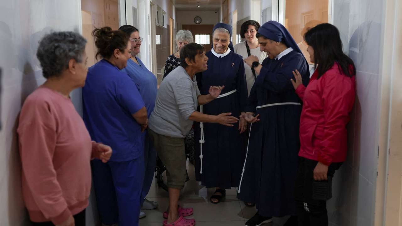 General superior of the congregation of the franciscan sisters of the cross, Mother Marie Makhlouf and Director of De La Croix Psychiatric Hospital, sister Rose Hanna, talk with patients at the hospital in Jal el-Dib