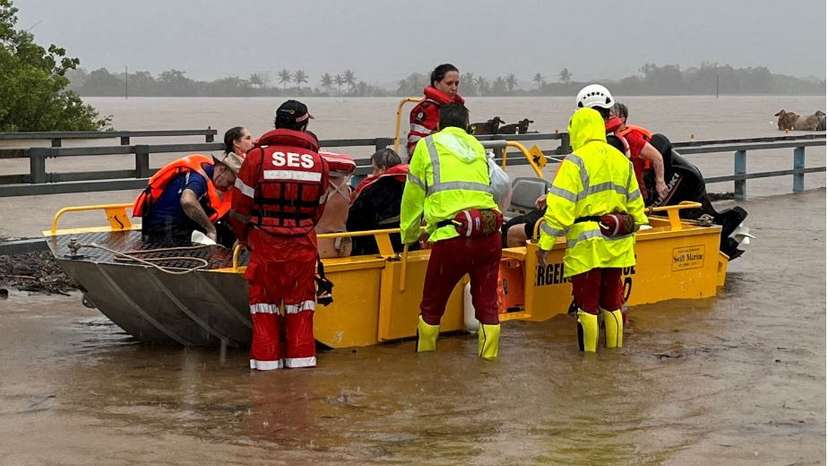 Emergency service personnel evacuate people in north Queensland after ex-tropical cyclone Jasper