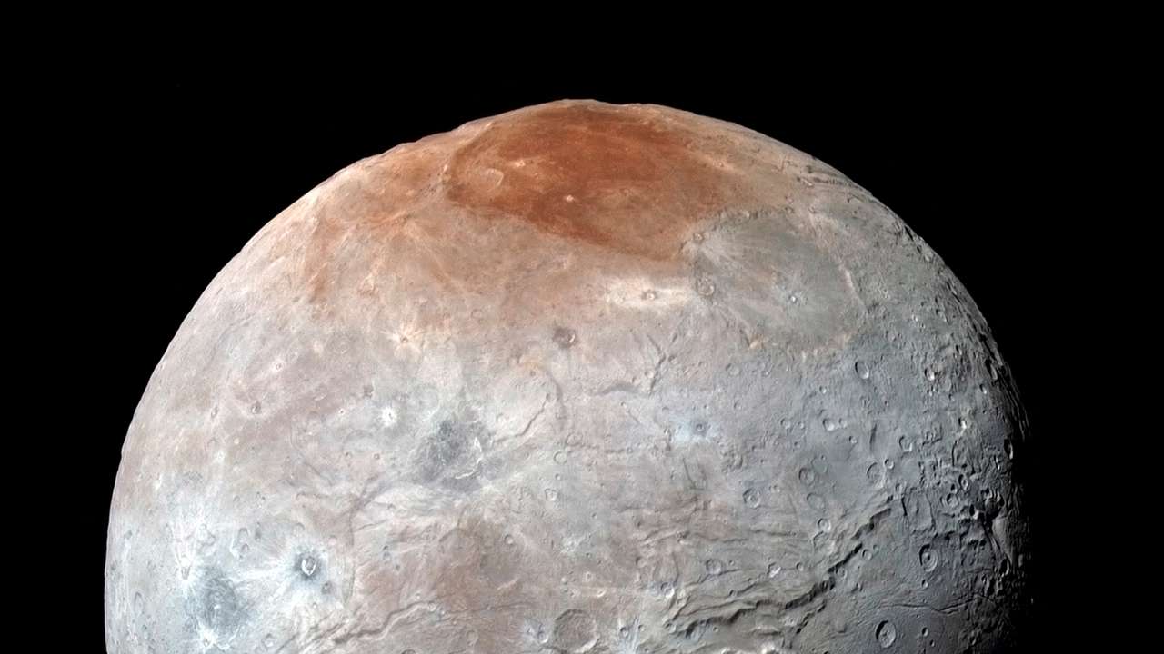 FILE PHOTO: Pluto's largest moon, Charon, is seen in a high-resolution, enhanced color view captured by NASA's New Horizons spacecraft
