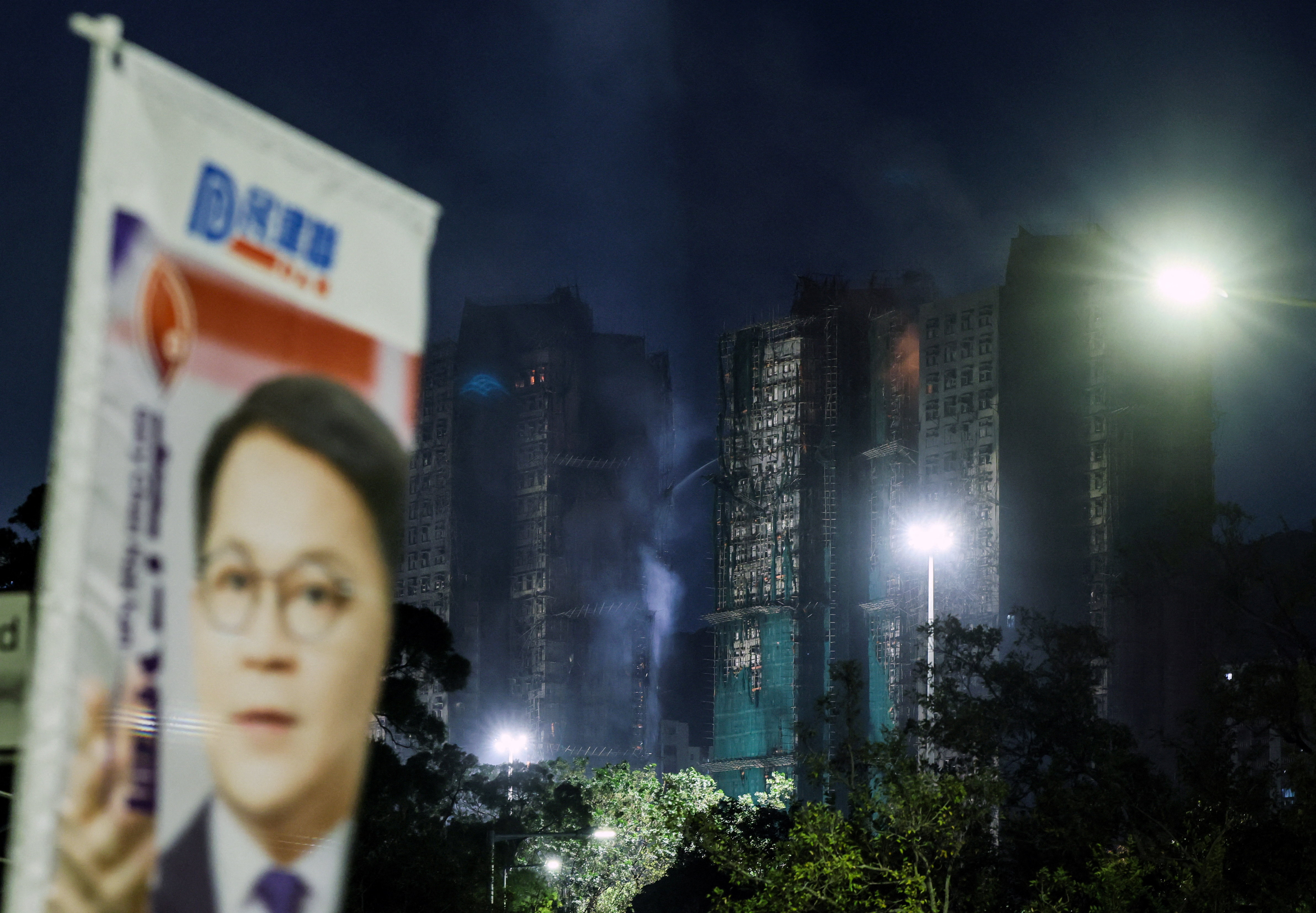 FILE PHOTO: Election sign for the upcoming Legislative Council election near the Wang Fuk Court housing complex in Hong Kong