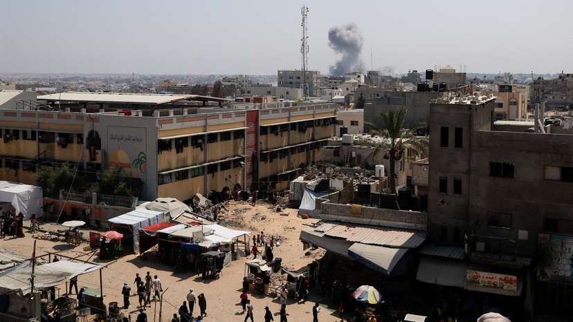 Smoke rises following an Israeli strike, in Khan Younis