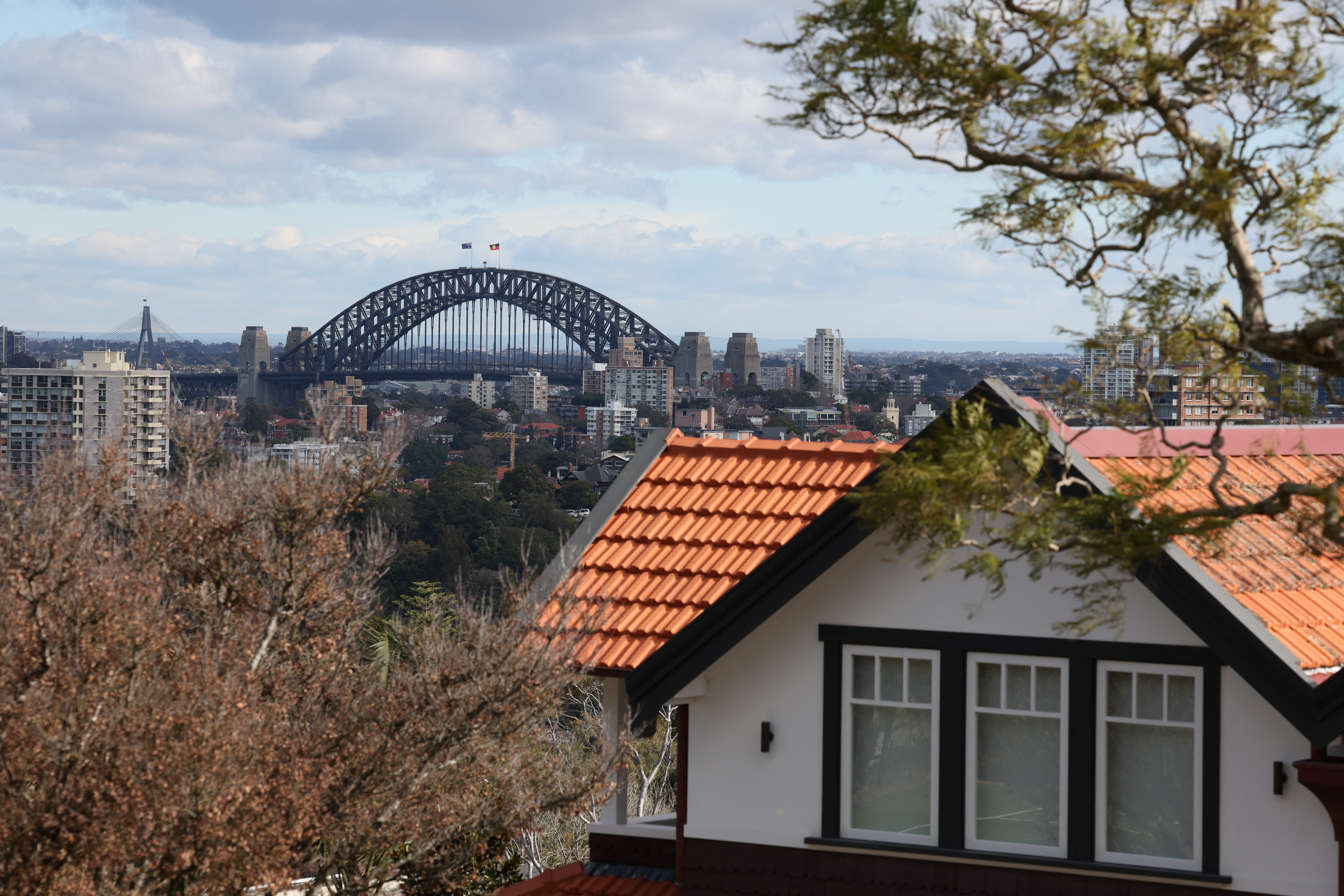 View of the Sydney Harbour Bridge next to a residential properties in Sydney