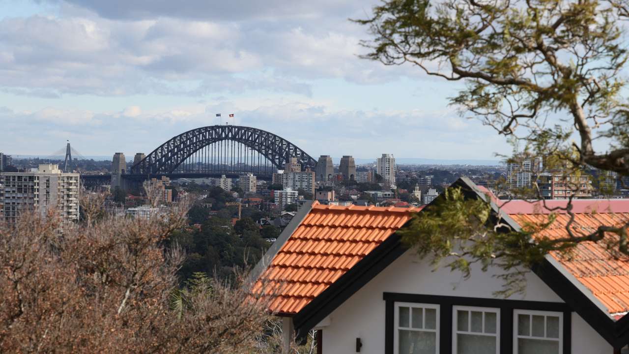 View of the Sydney Harbour Bridge next to a residential properties in Sydney
