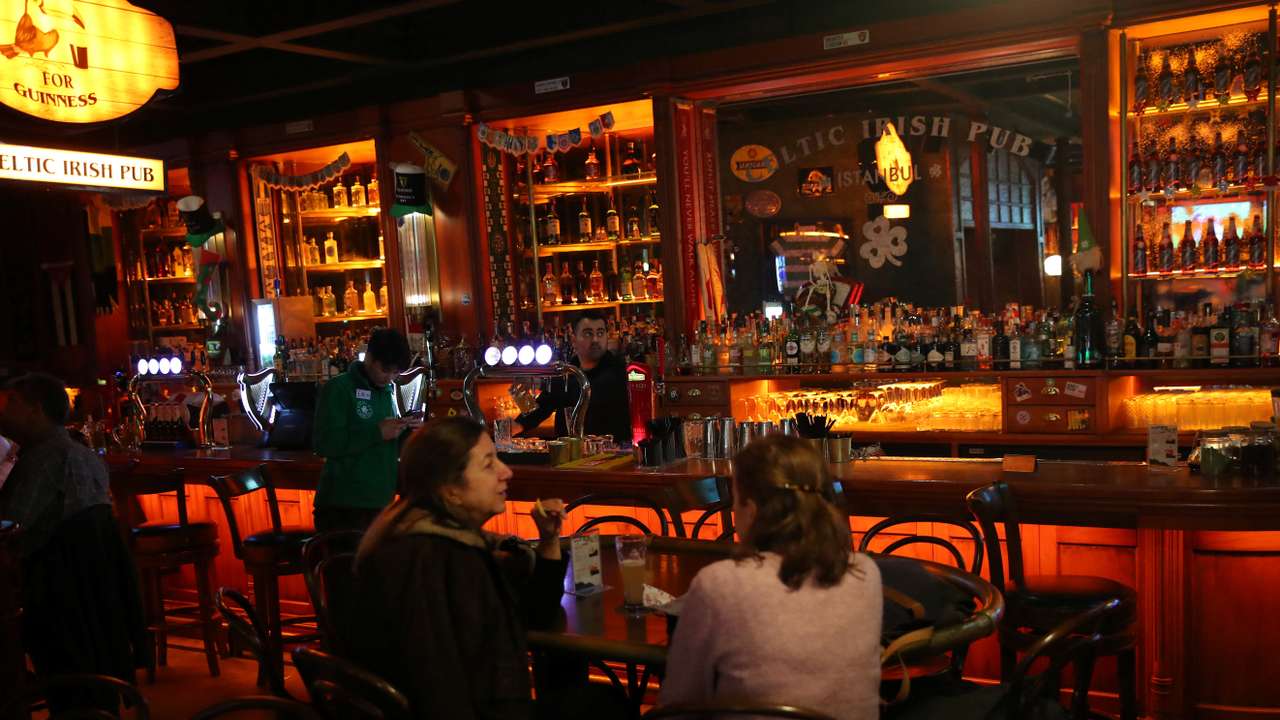 People enjoy their drinks outside at a bar in Istanbul