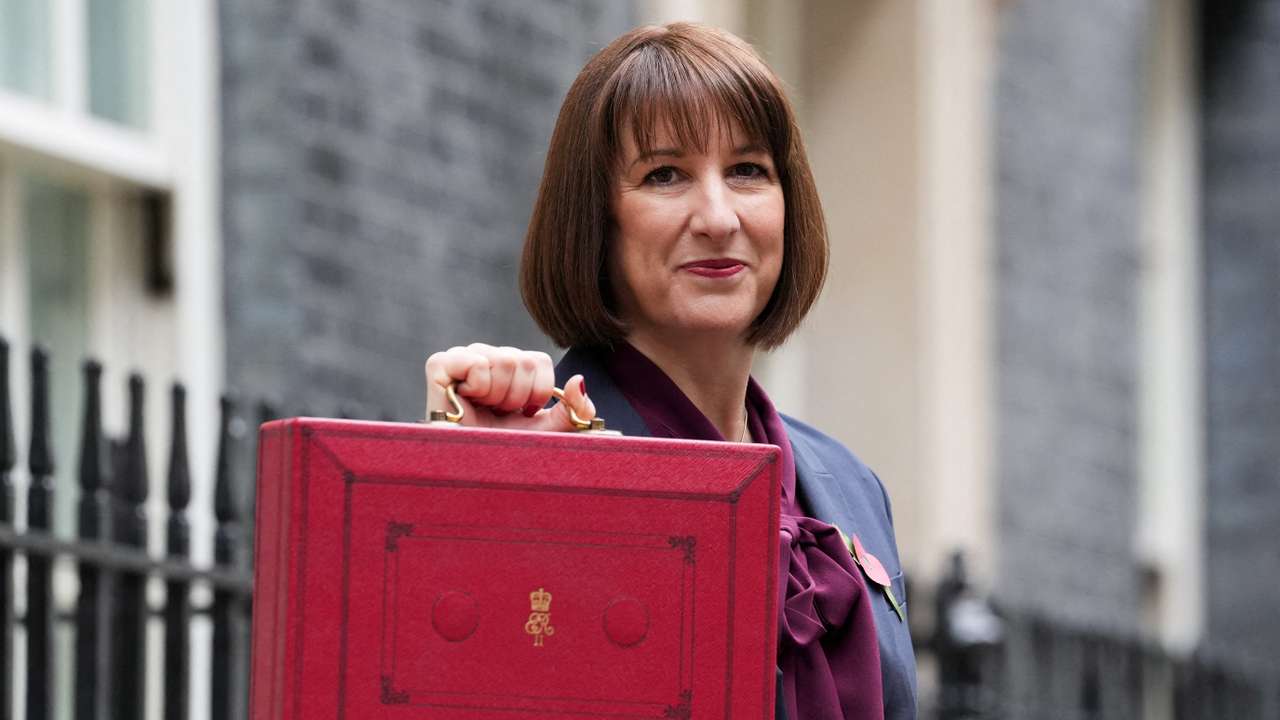 FILE PHOTO: Britain's Chancellor of the Exchequer Reeves carries the red budget box at Downing Street, in London