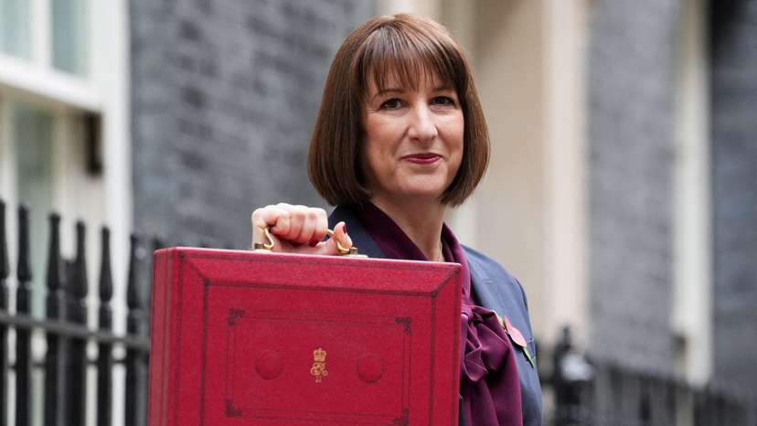 FILE PHOTO: Britain's Chancellor of the Exchequer Reeves carries the red budget box at Downing Street, in London