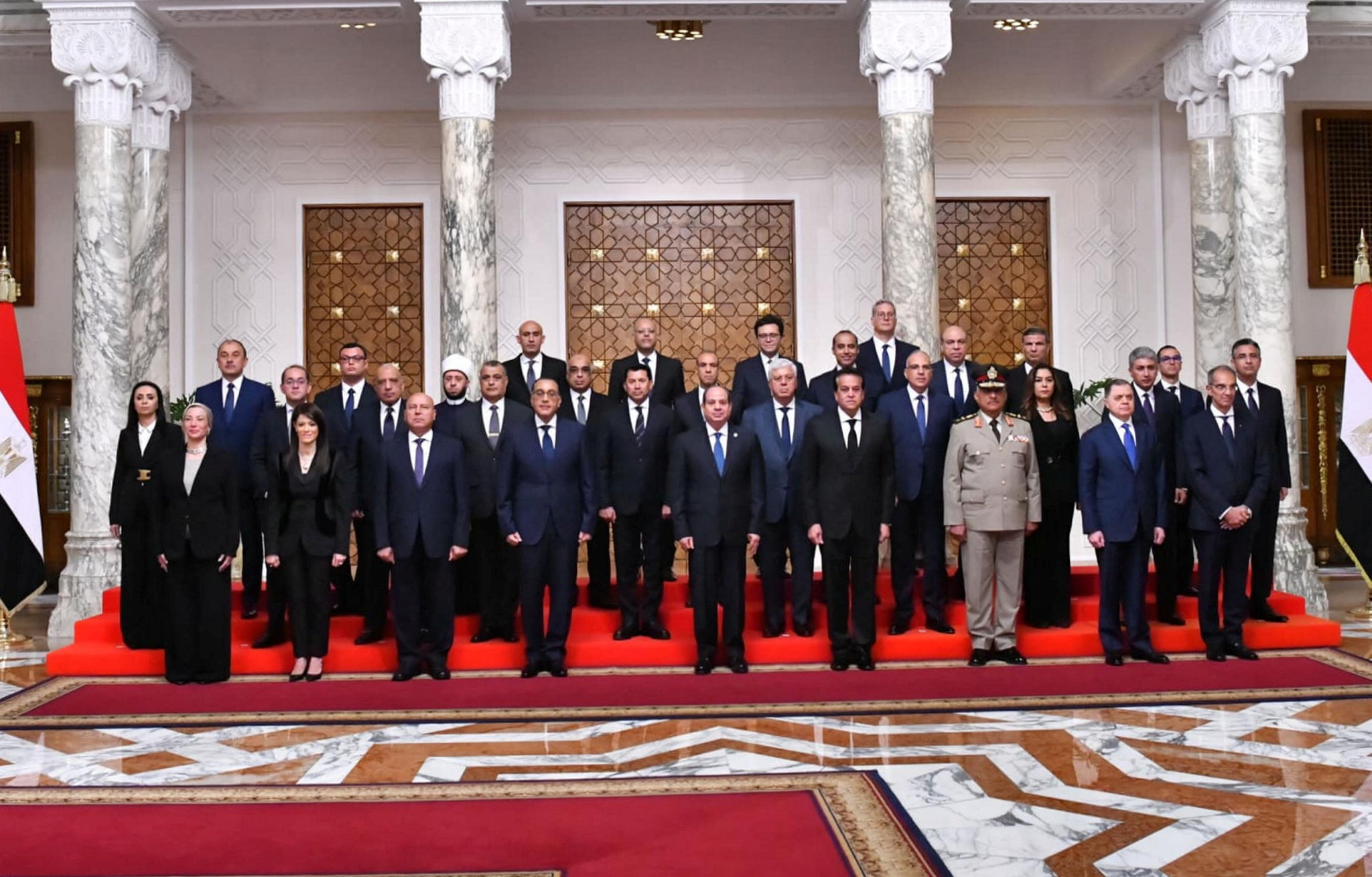 Egyptian President Abdel Fattah al-Sisi poses for a group photo along with Egypt's new cabinet after the swears-in at Al-Ittihadiya presidential palace in Cairo