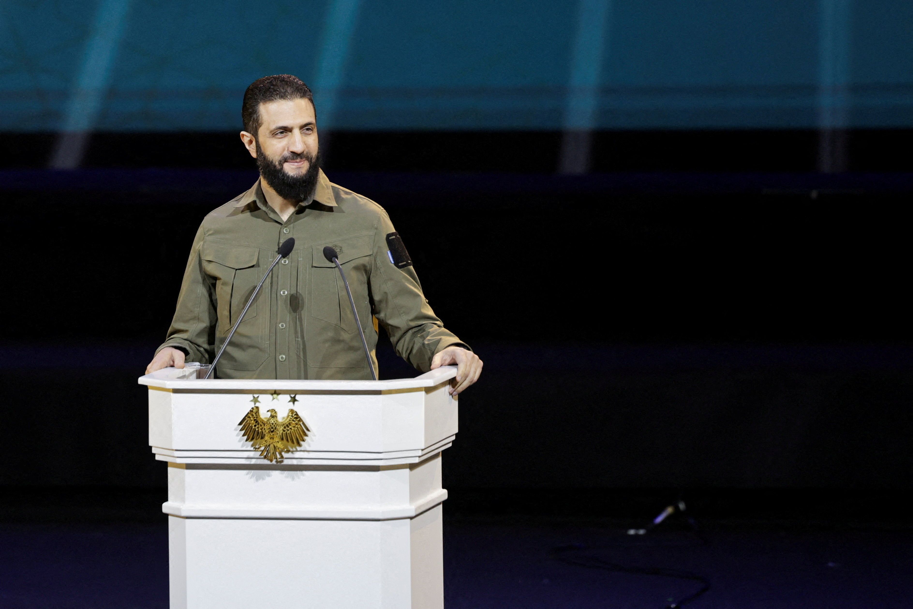 FILE PHOTO: Syria's President Ahmed al-Sharaa delivers a speech on the first anniversary of Bashar al-Assad's fall