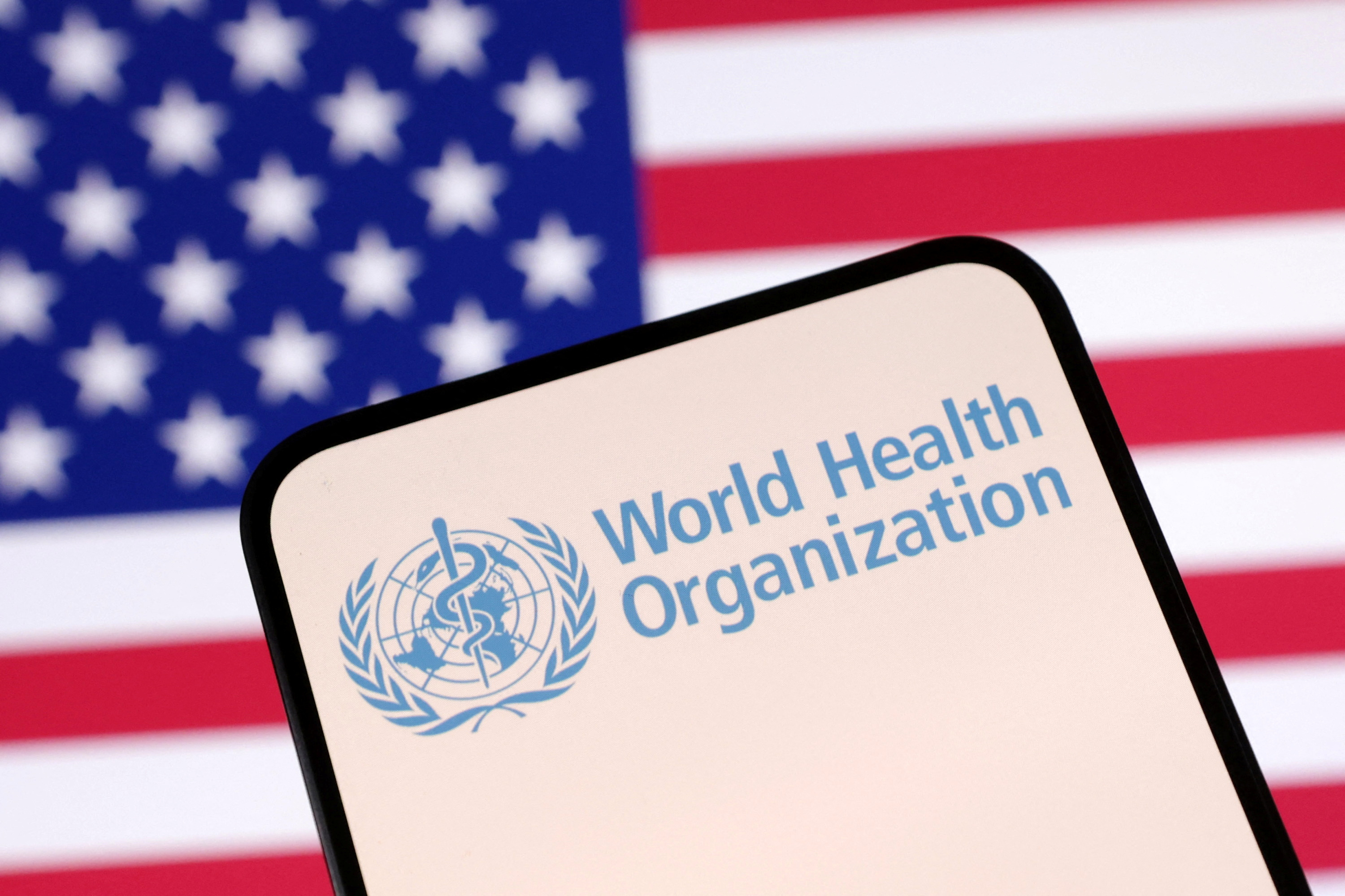 Illustration shows World Health Organization (WHO) logo and U.S. flag