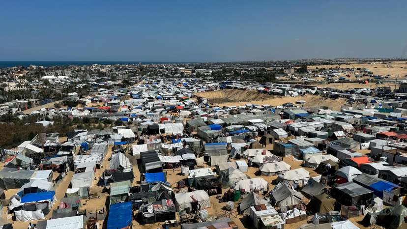 FILE PHOTO: Displaced Palestinians, who fled their houses due to Israeli strikes, shelter in a tent camp, in Rafah