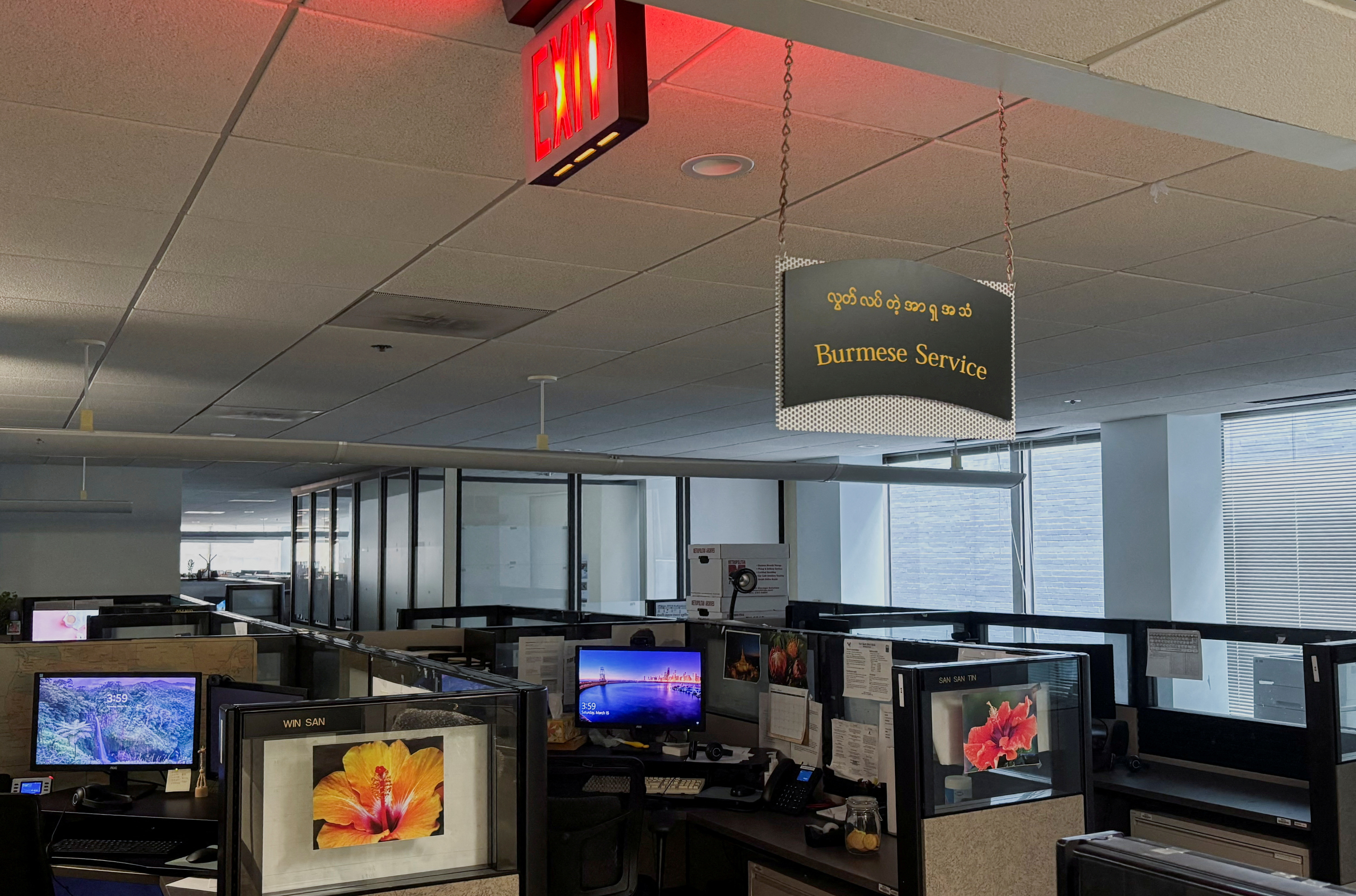FILE PHOTO: A sign for the Burmese-language service in the offices of Radio Free Asia is displayed following the termination of funding for RFA, in Washington