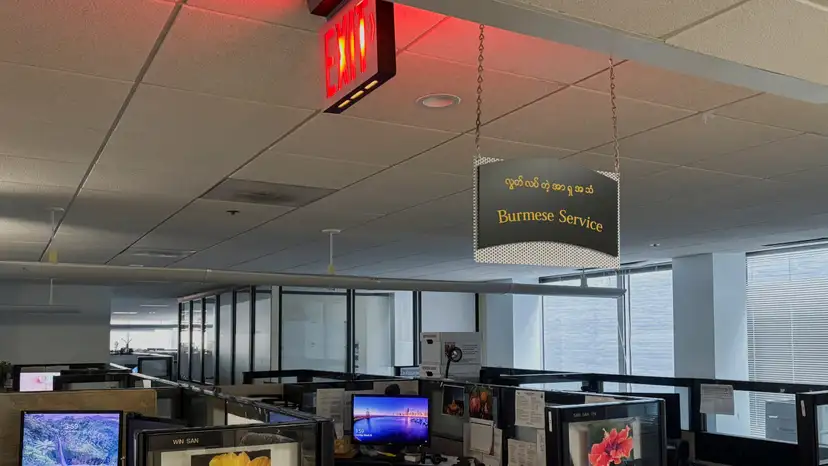 FILE PHOTO: A sign for the Burmese-language service in the offices of Radio Free Asia is displayed following the termination of funding for RFA, in Washington