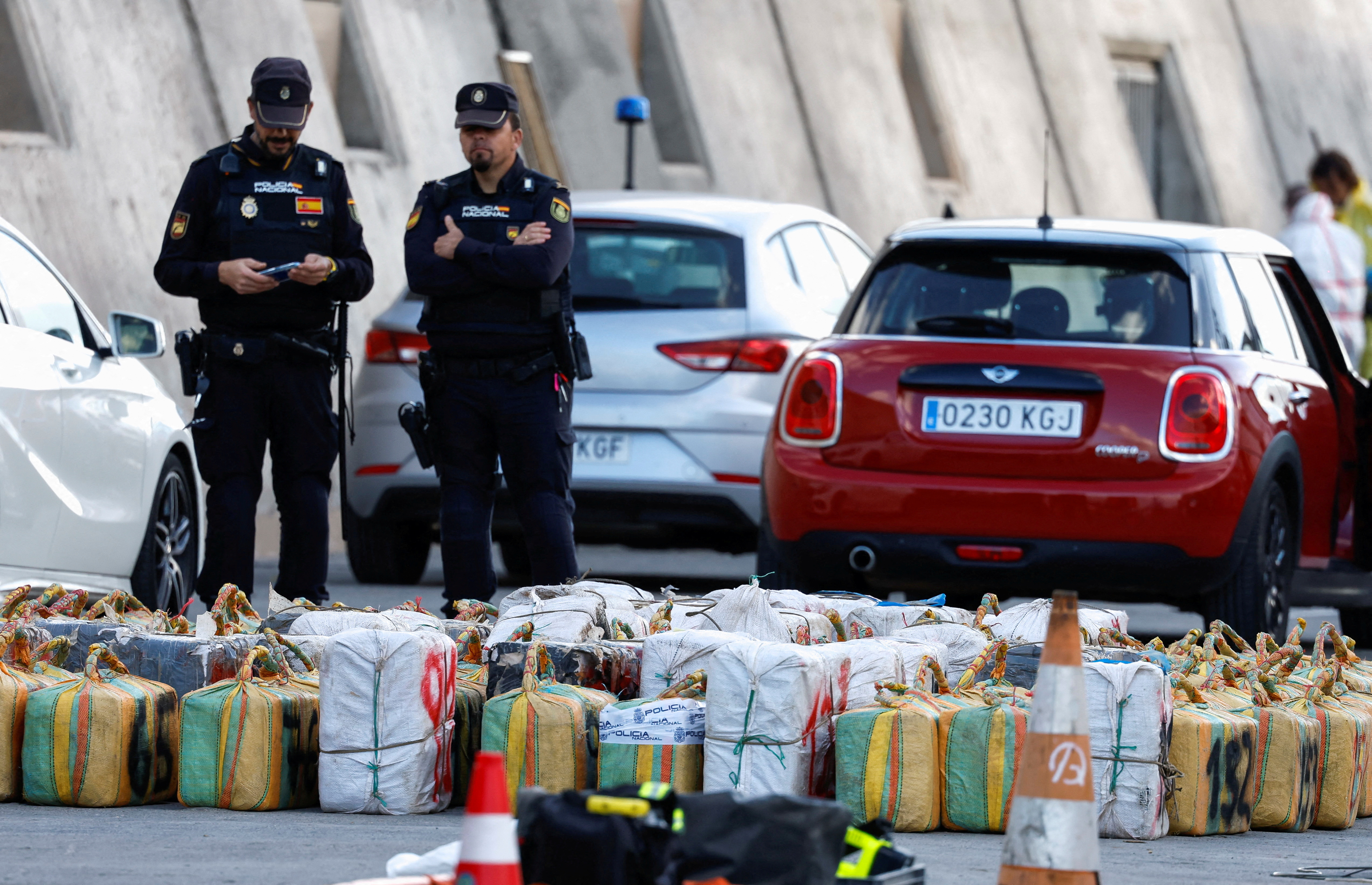 Police officers discharge drugs from the cattle ship Orion V that was seized off the Canary Islands, in the port of Las Palmas