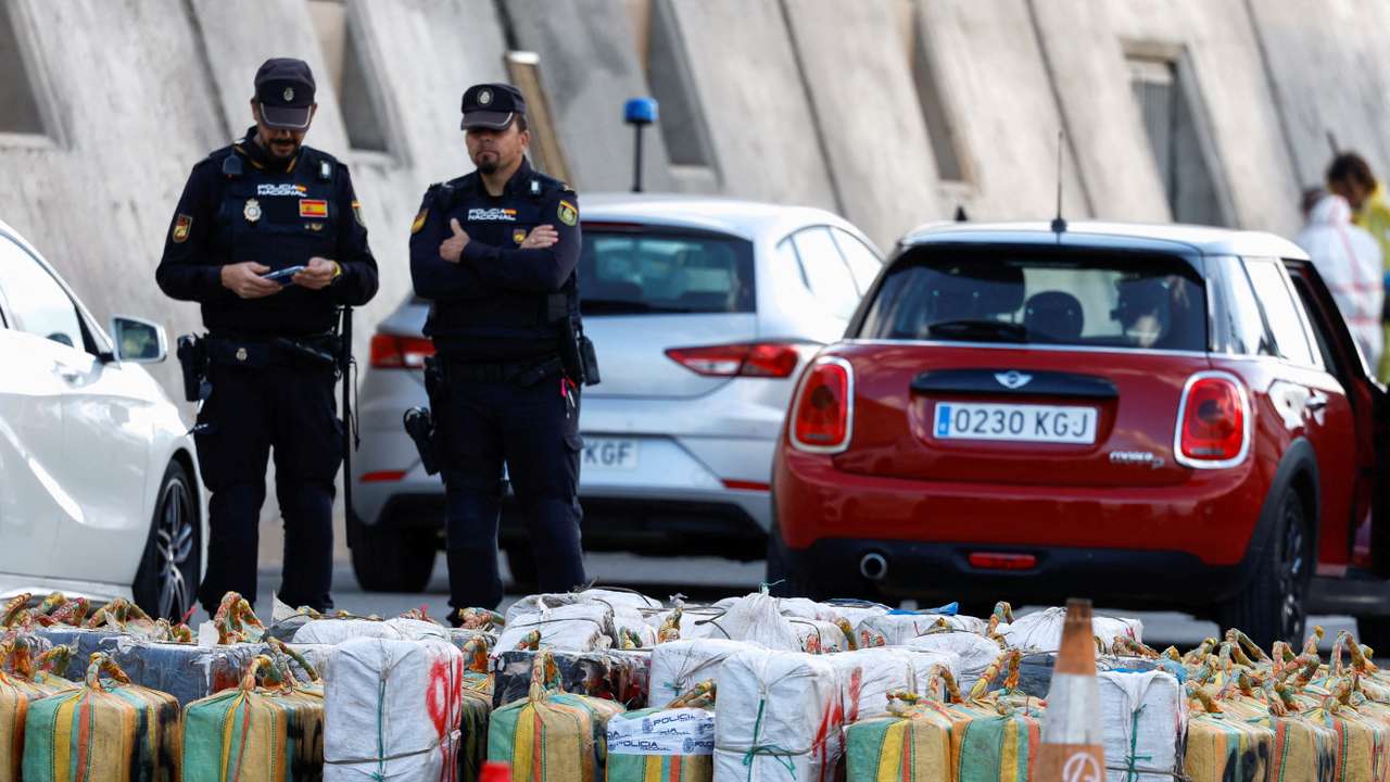 Police officers discharge drugs from the cattle ship Orion V that was seized off the Canary Islands, in the port of Las Palmas